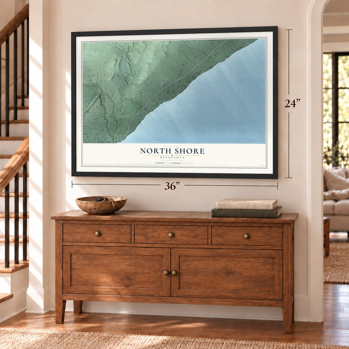 North Shore, Minnesota map, 24 x 36 inch print in a black frame above a dresser by a staircase