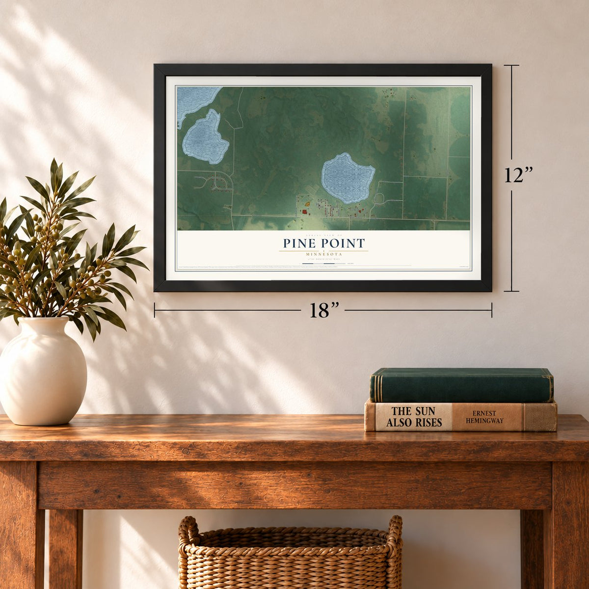 Pine Point, Minnesota map, 12 x 18 inch print in a black frame in an entryway