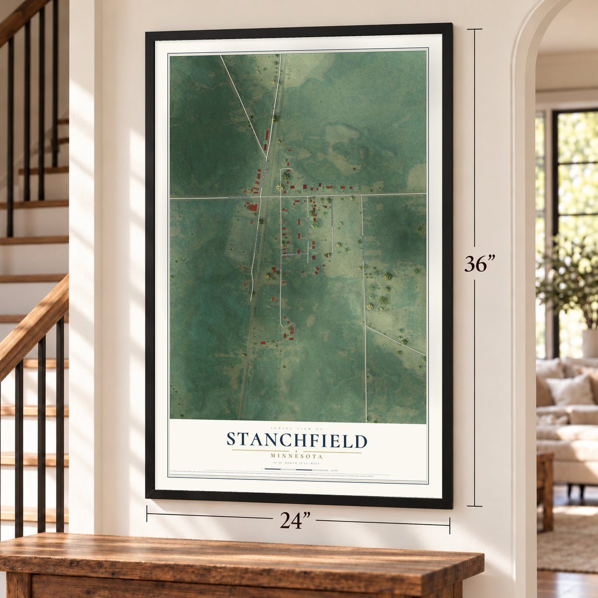 Stanchfield, Minnesota map, 24 x 36 inch print in a black frame by a staircase