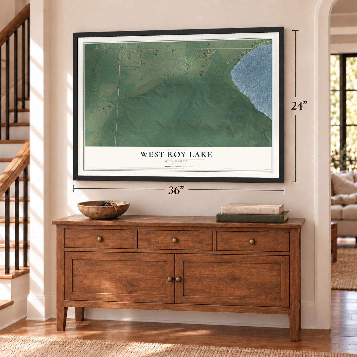 West Roy Lake, Minnesota map, 24 x 36 inch print in a black frame above a dresser by a staircase