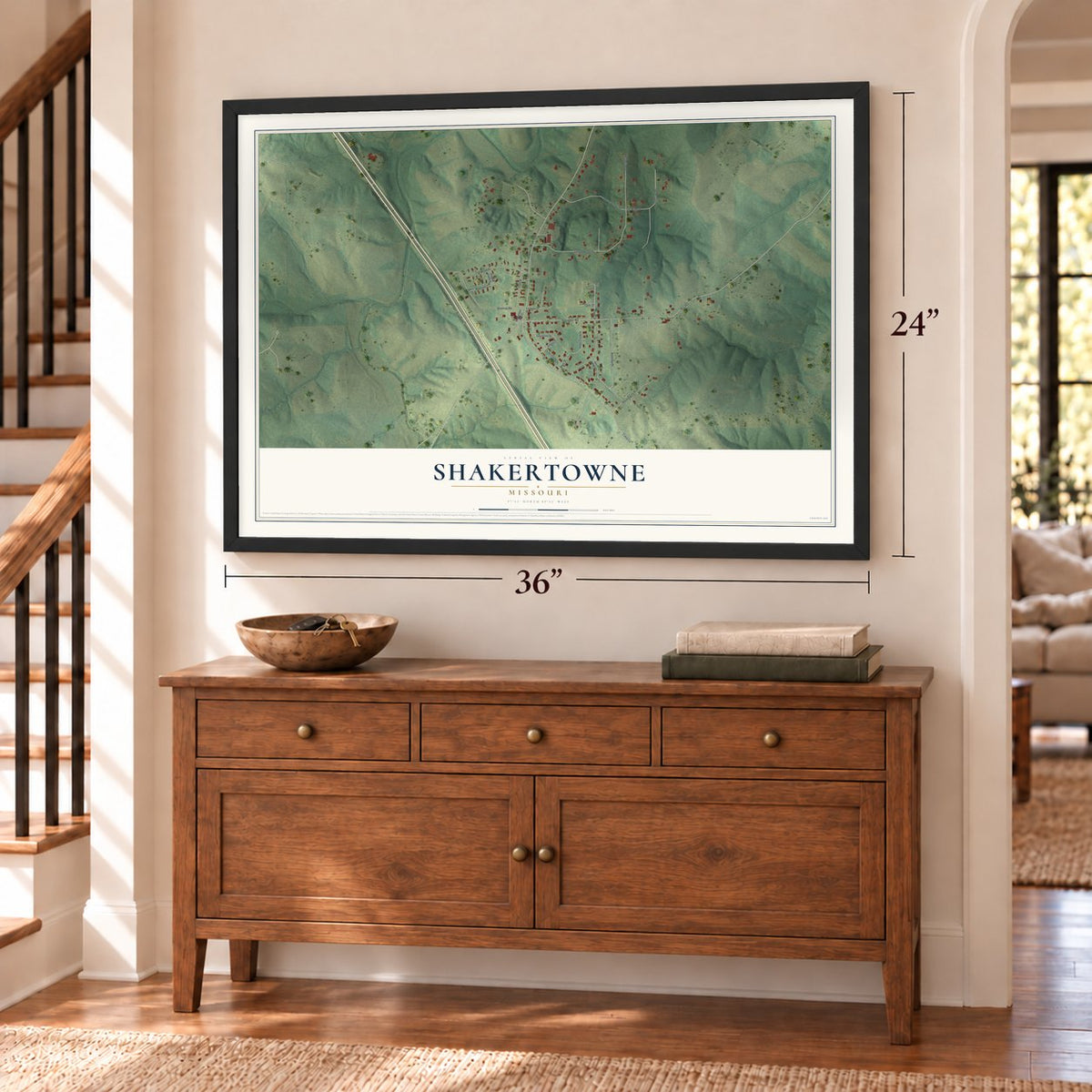 Shakertowne, Missouri map, 24 x 36 inch print in a black frame above a dresser by a staircase