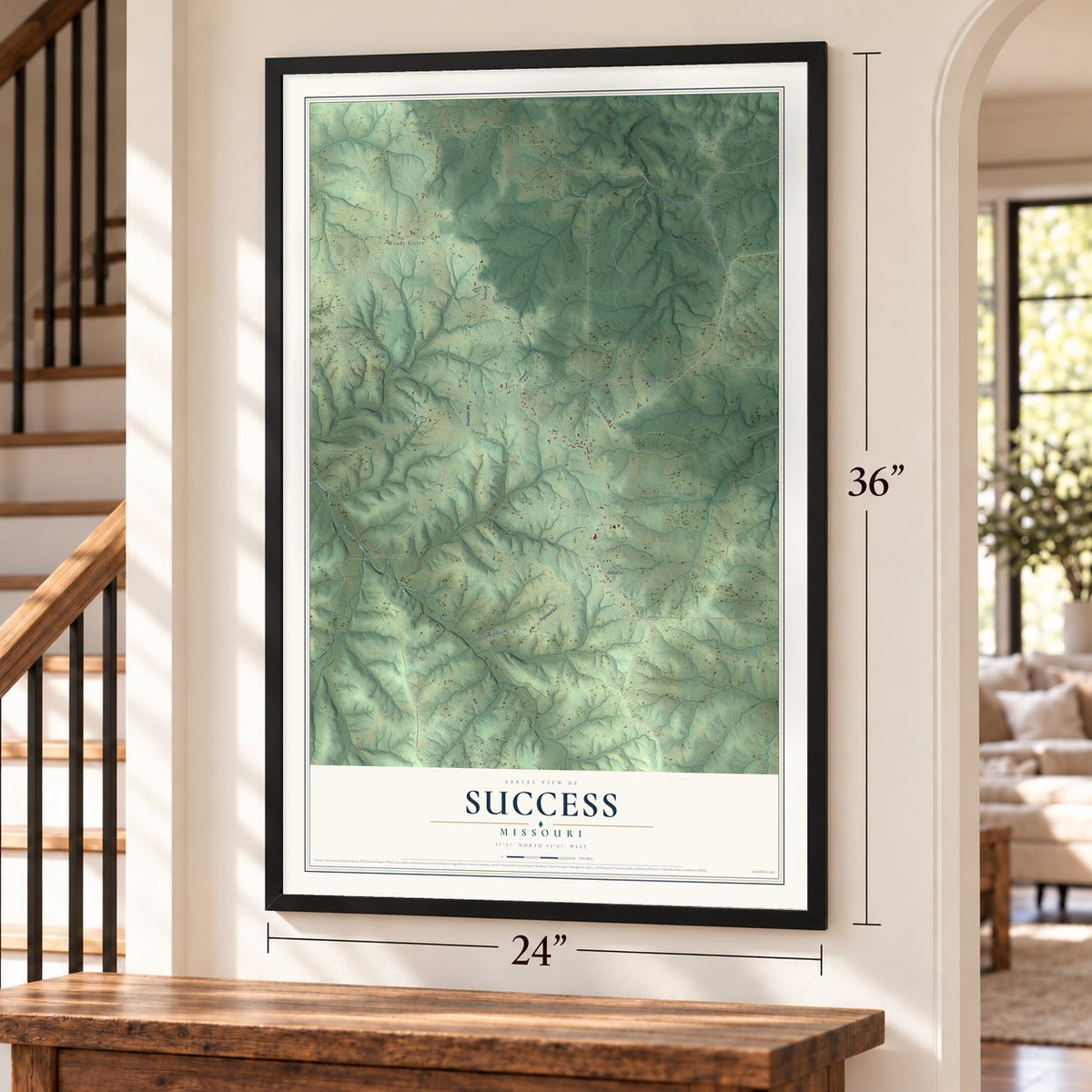 Success, Missouri map, 24 x 36 inch print in a black frame by a staircase