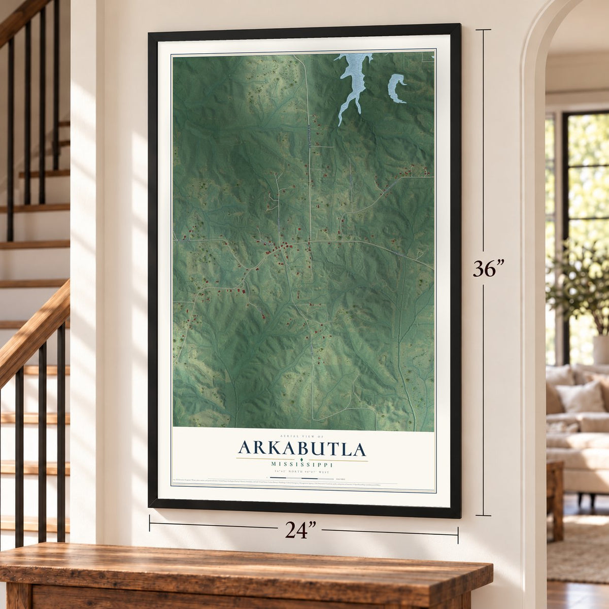 Arkabutla, Mississippi map, 24 x 36 inch print in a black frame by a staircase