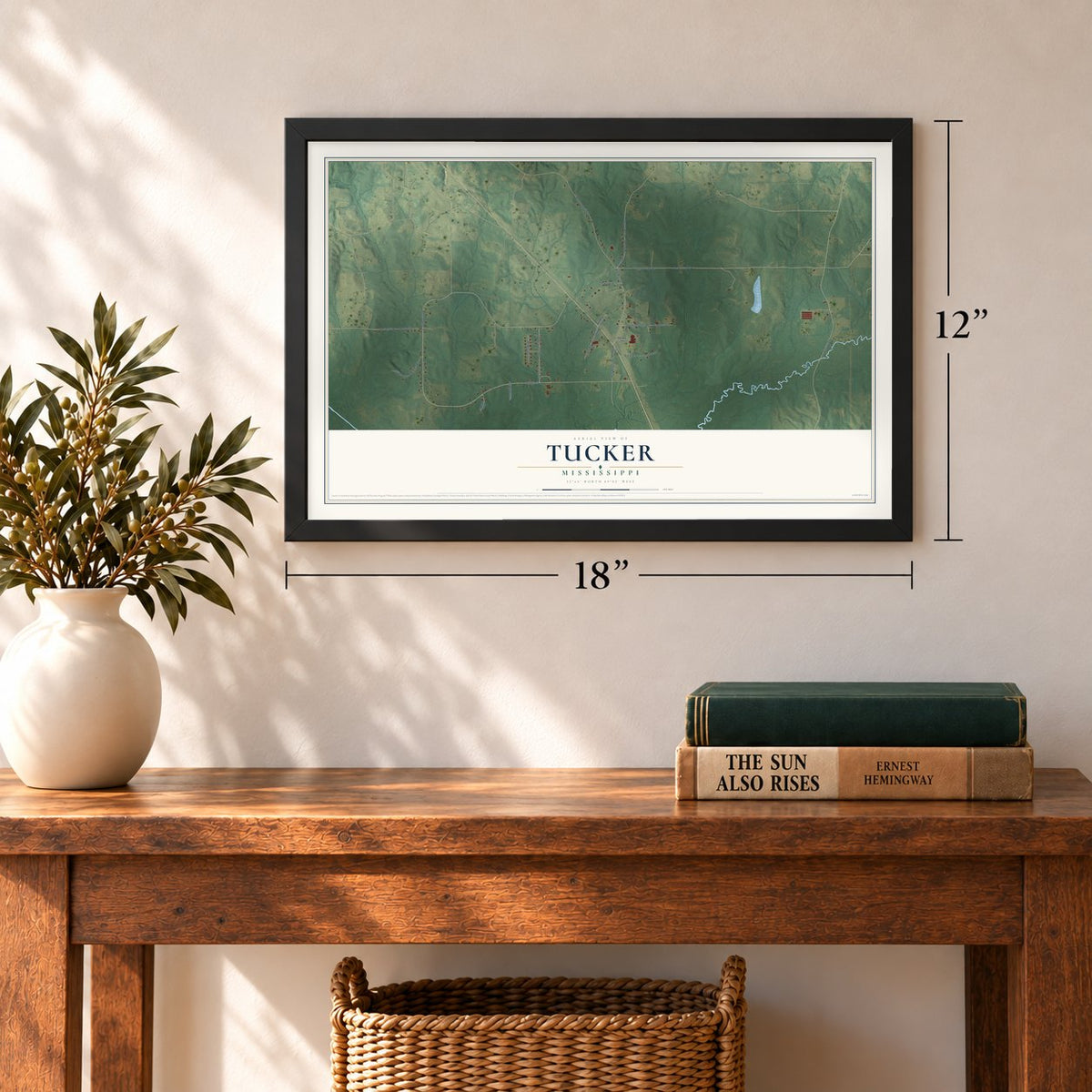 Tucker, Mississippi map, 12 x 18 inch print in a black frame in an entryway