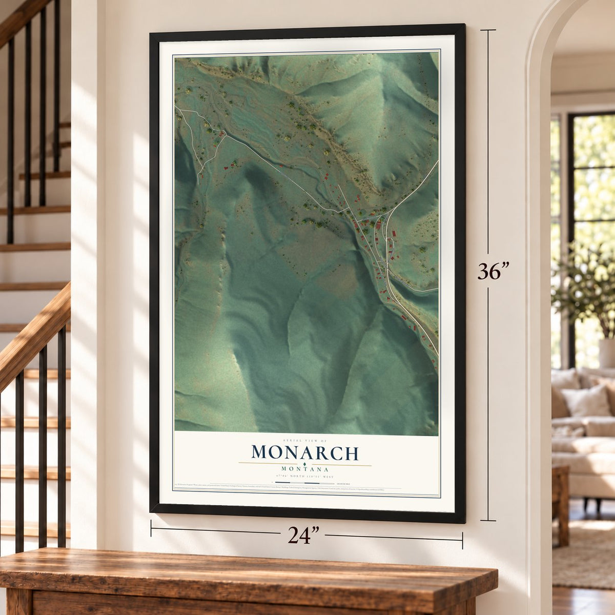 Monarch, Montana map, 24 x 36 inch print in a black frame by a staircase