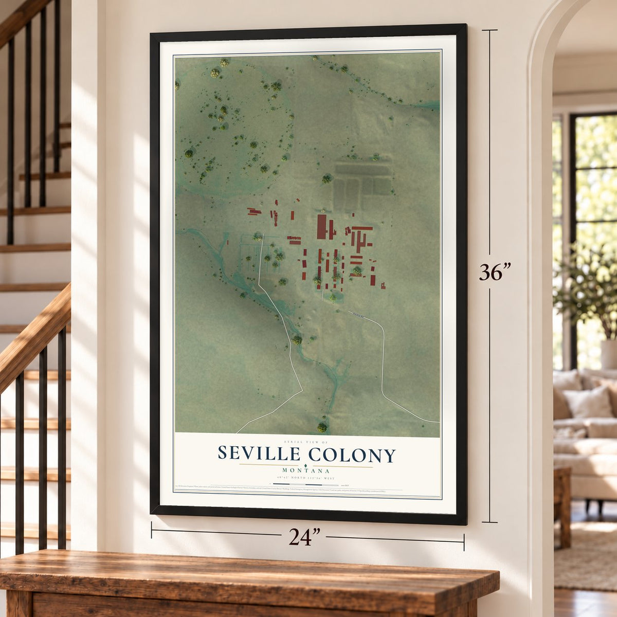 Seville Colony, Montana map, 24 x 36 inch print in a black frame by a staircase