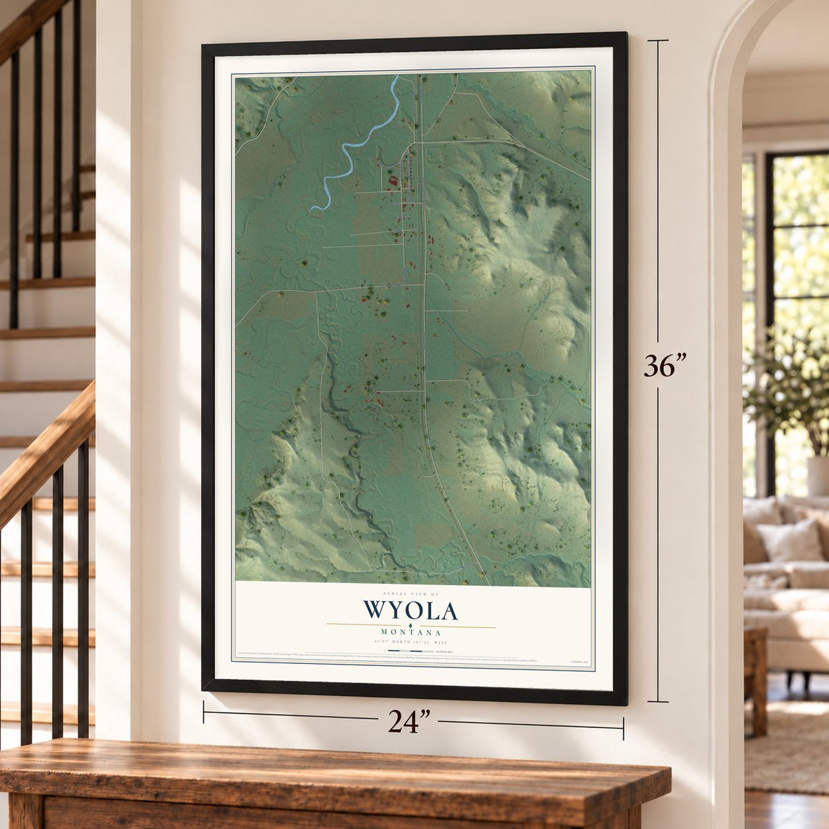 Wyola, Montana map, 24 x 36 inch print in a black frame by a staircase