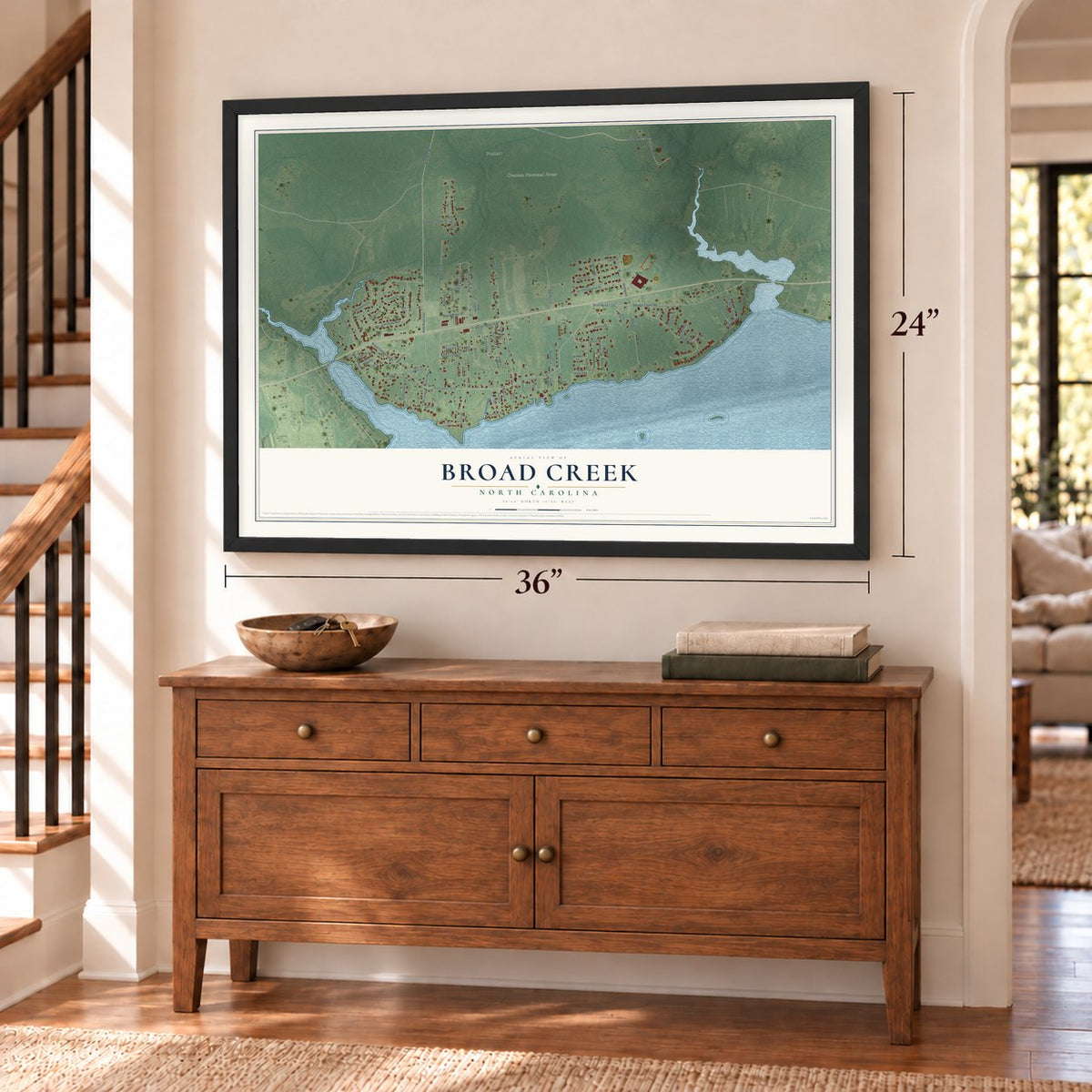Broad Creek, North Carolina map, 24 x 36 inch print in a black frame above a dresser by a staircase