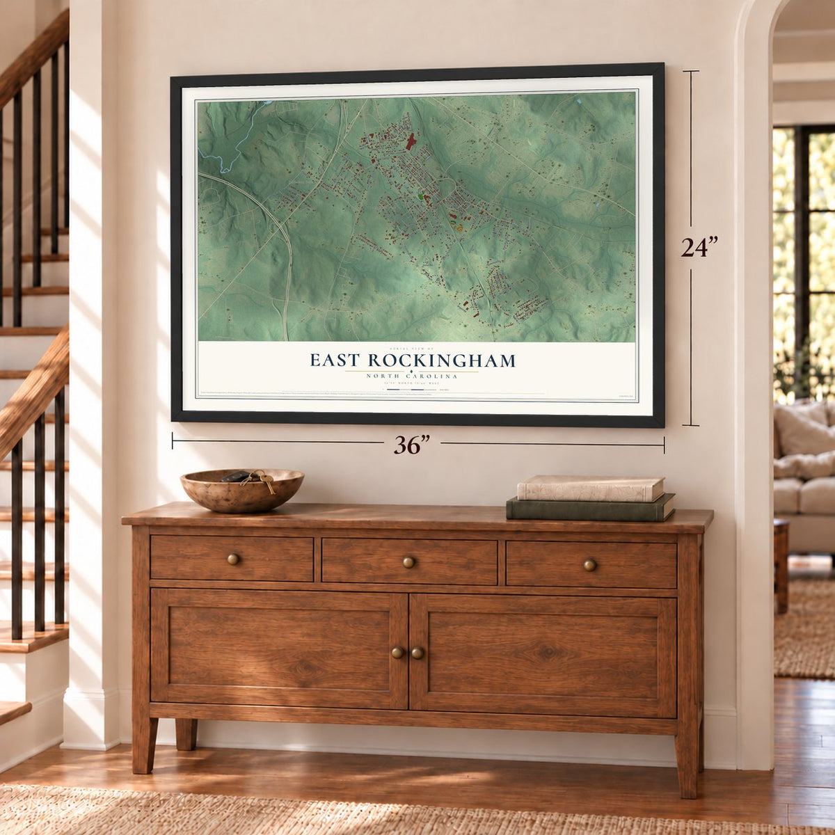 East Rockingham, North Carolina map, 24 x 36 inch print in a black frame above a dresser by a staircase