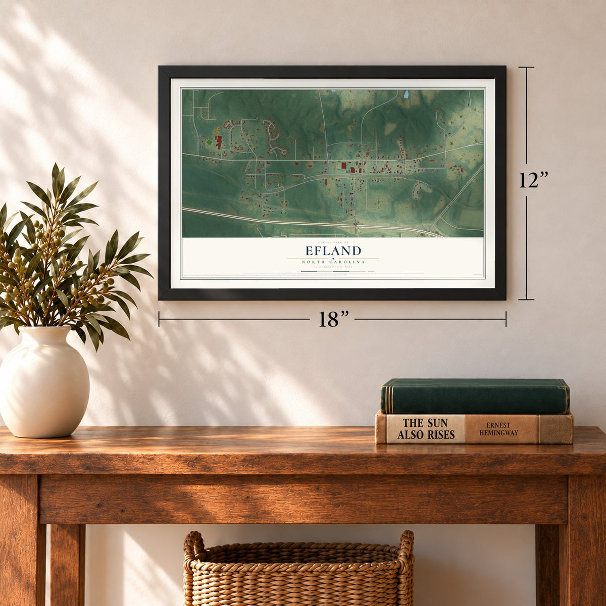 Efland, North Carolina map, 12 x 18 inch print in a black frame in an entryway