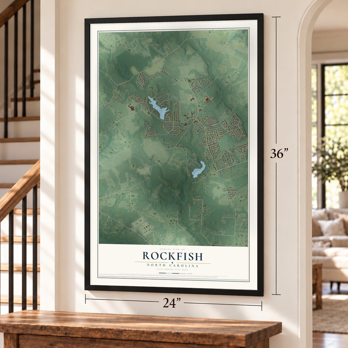 Rockfish, North Carolina map, 24 x 36 inch print in a black frame by a staircase