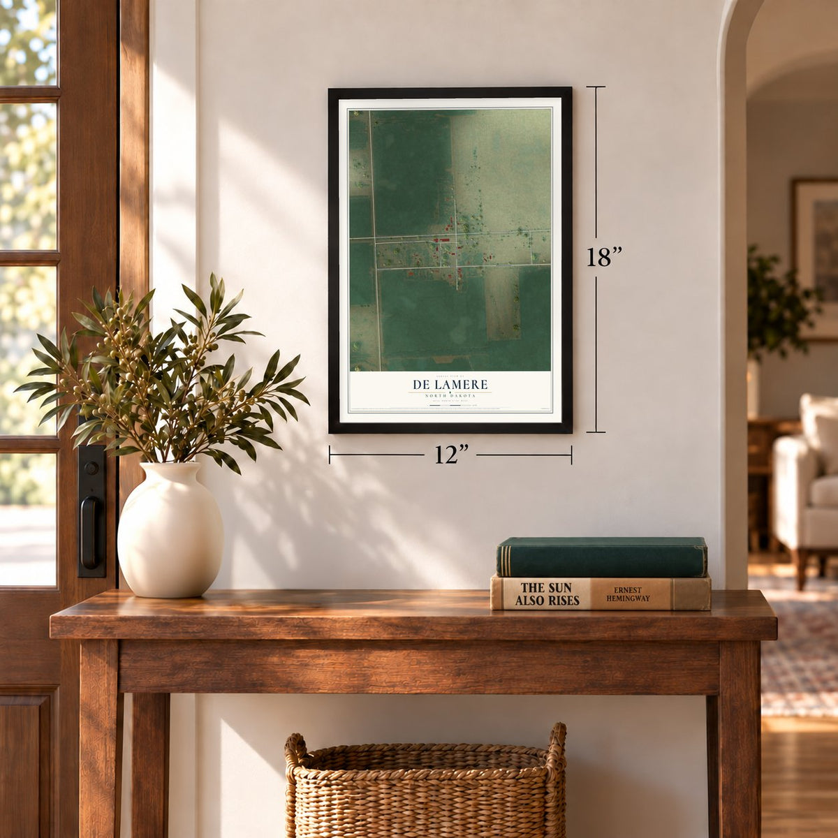 De Lamere, North Dakota map, 12 x 18 inch print in a black frame in an entryway