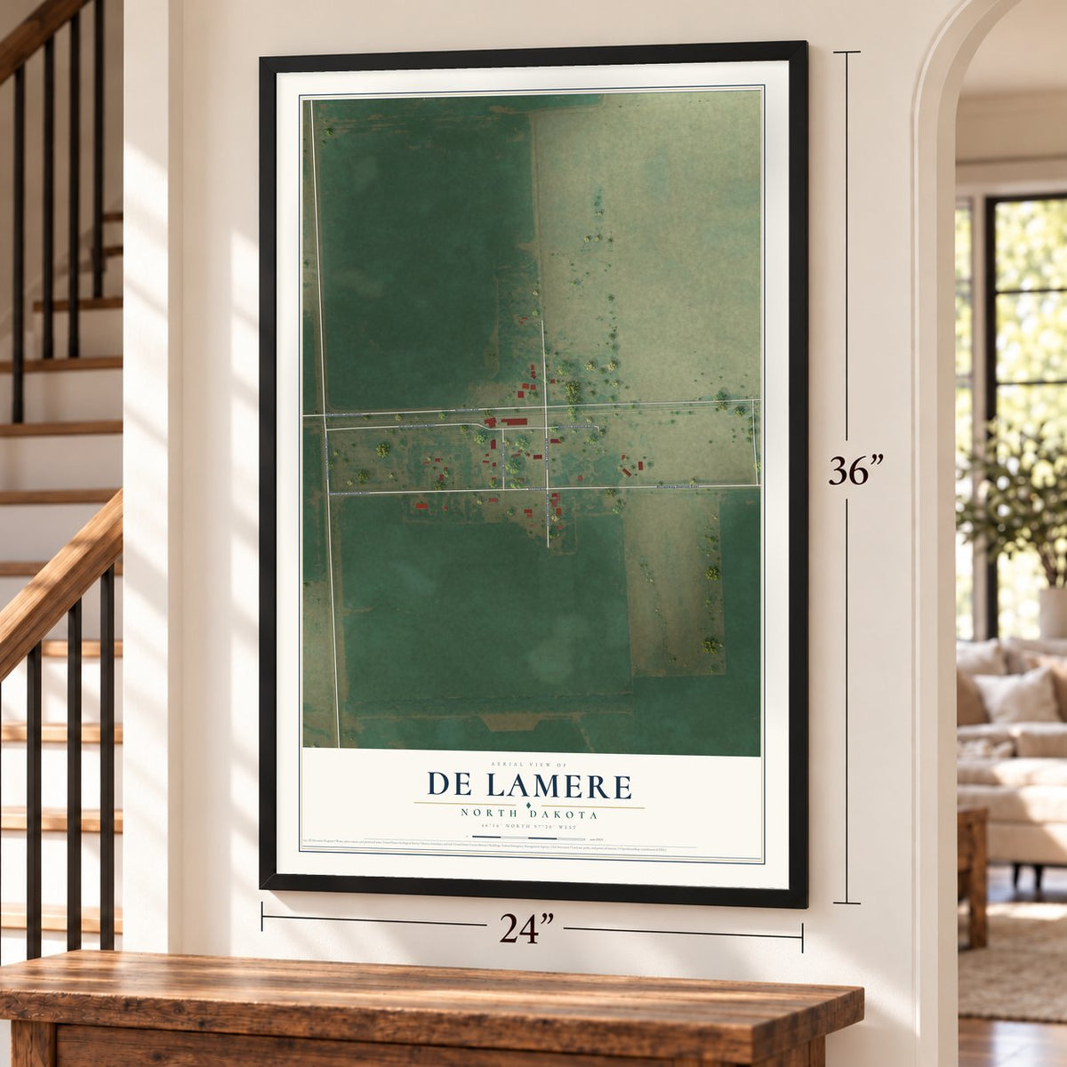 De Lamere, North Dakota map, 24 x 36 inch print in a black frame by a staircase