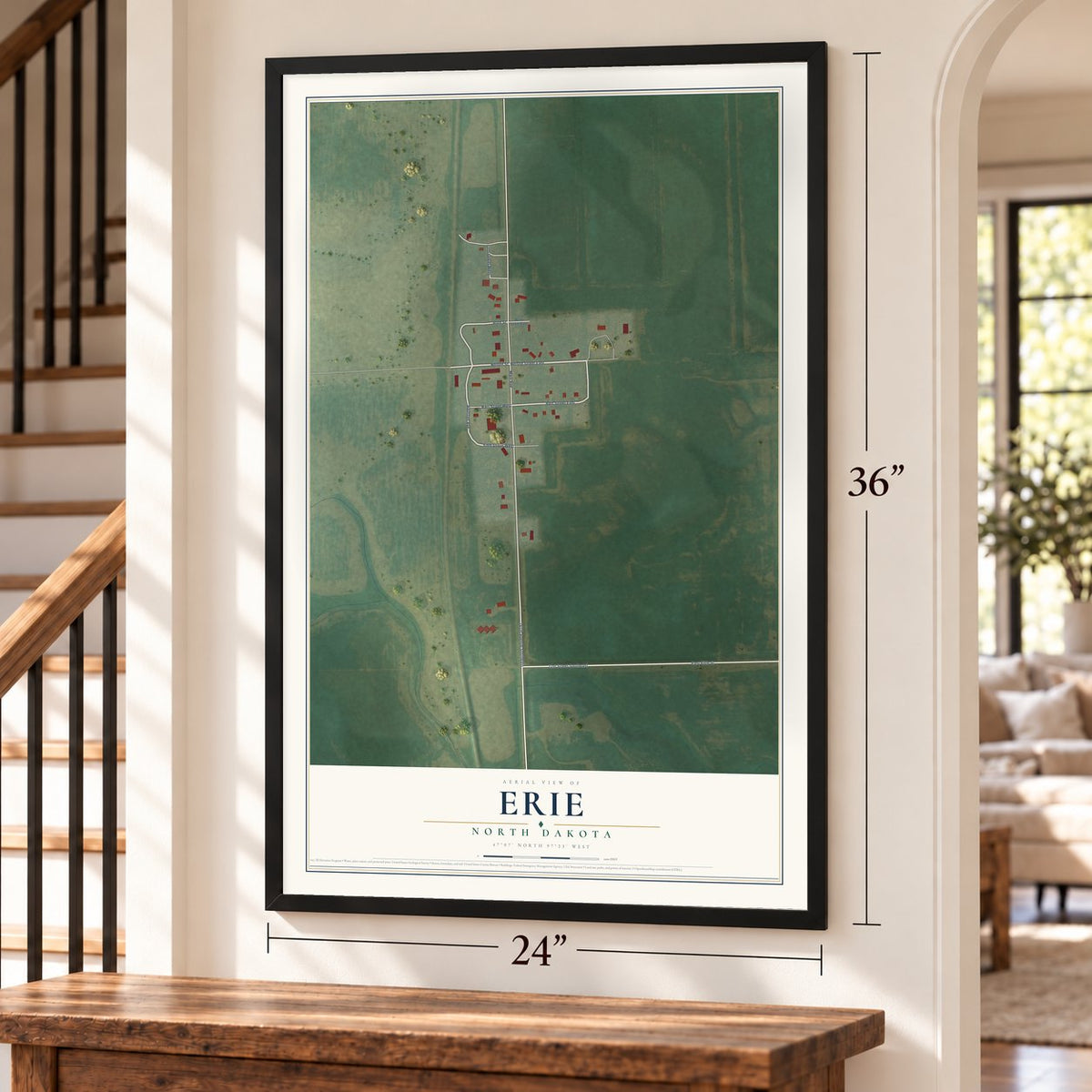 Erie, North Dakota map, 24 x 36 inch print in a black frame by a staircase
