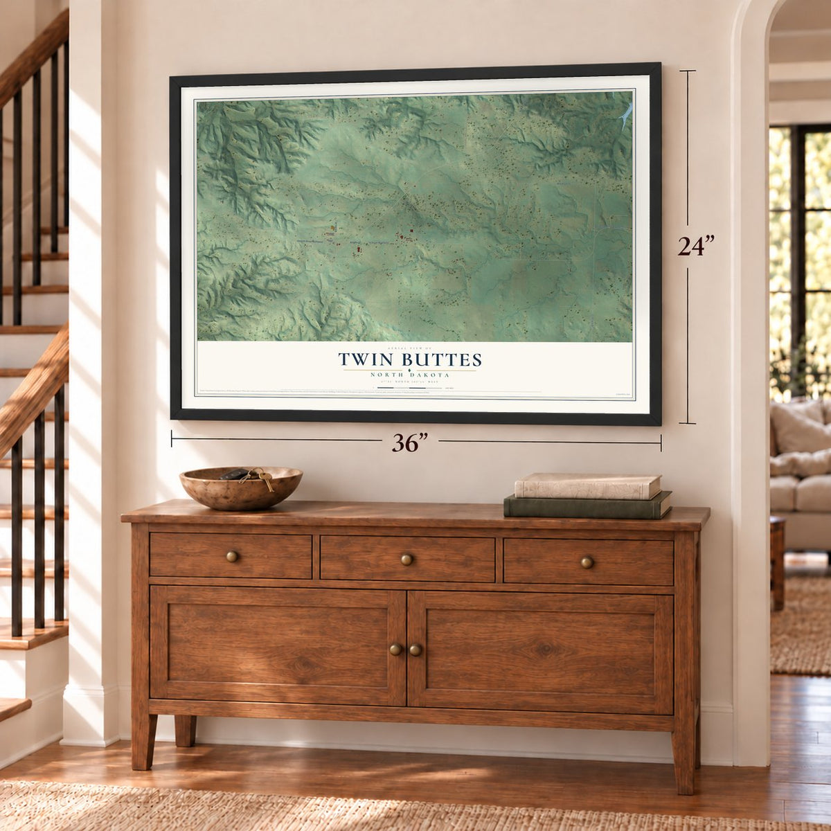 Twin Buttes, North Dakota map, 24 x 36 inch print in a black frame above a dresser by a staircase