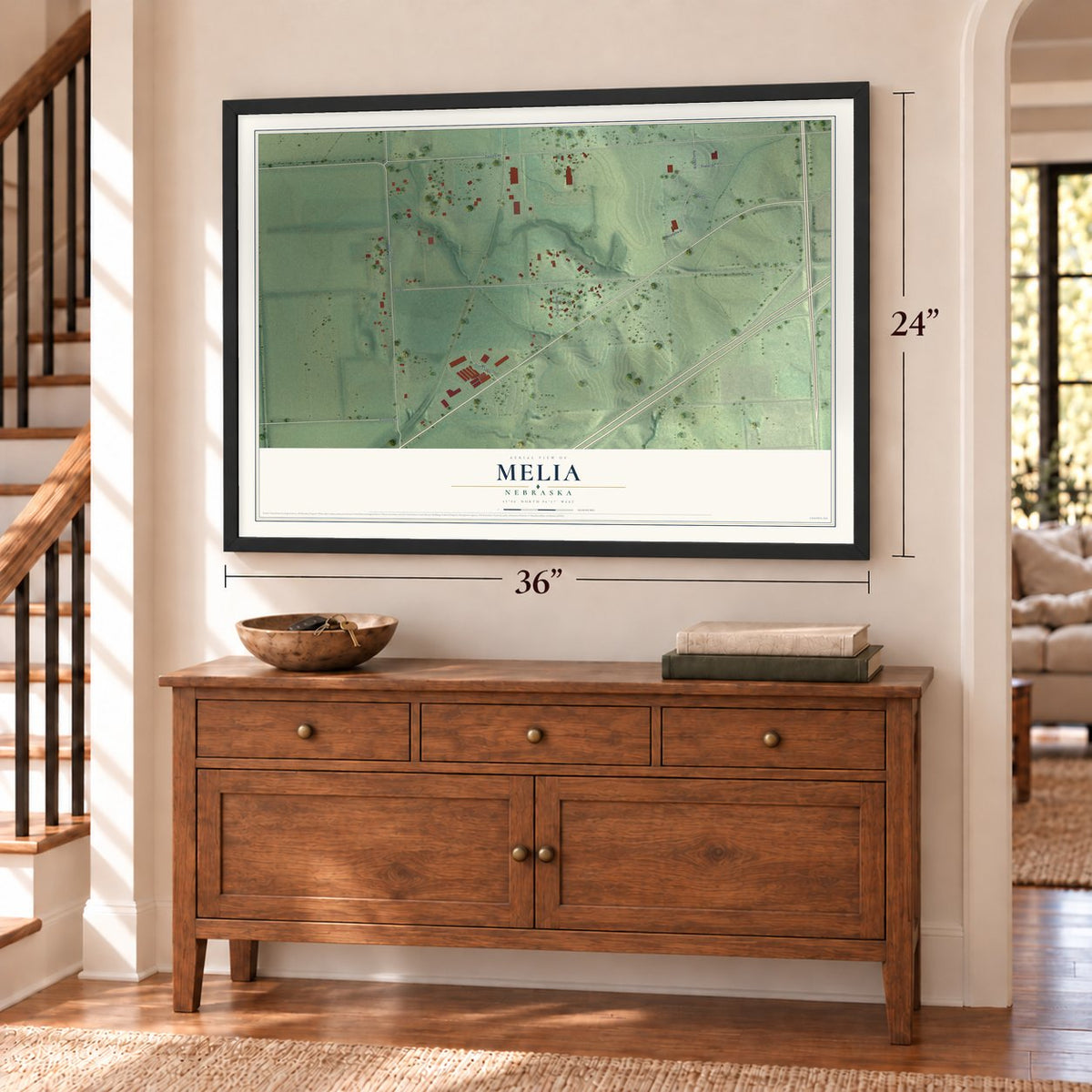 Melia, Nebraska map, 24 x 36 inch print in a black frame above a dresser by a staircase