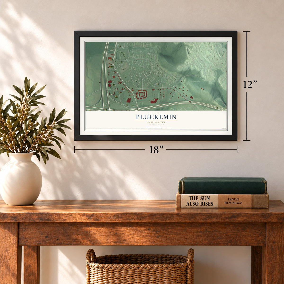 Pluckemin, New Jersey map, 12 x 18 inch print in a black frame in an entryway