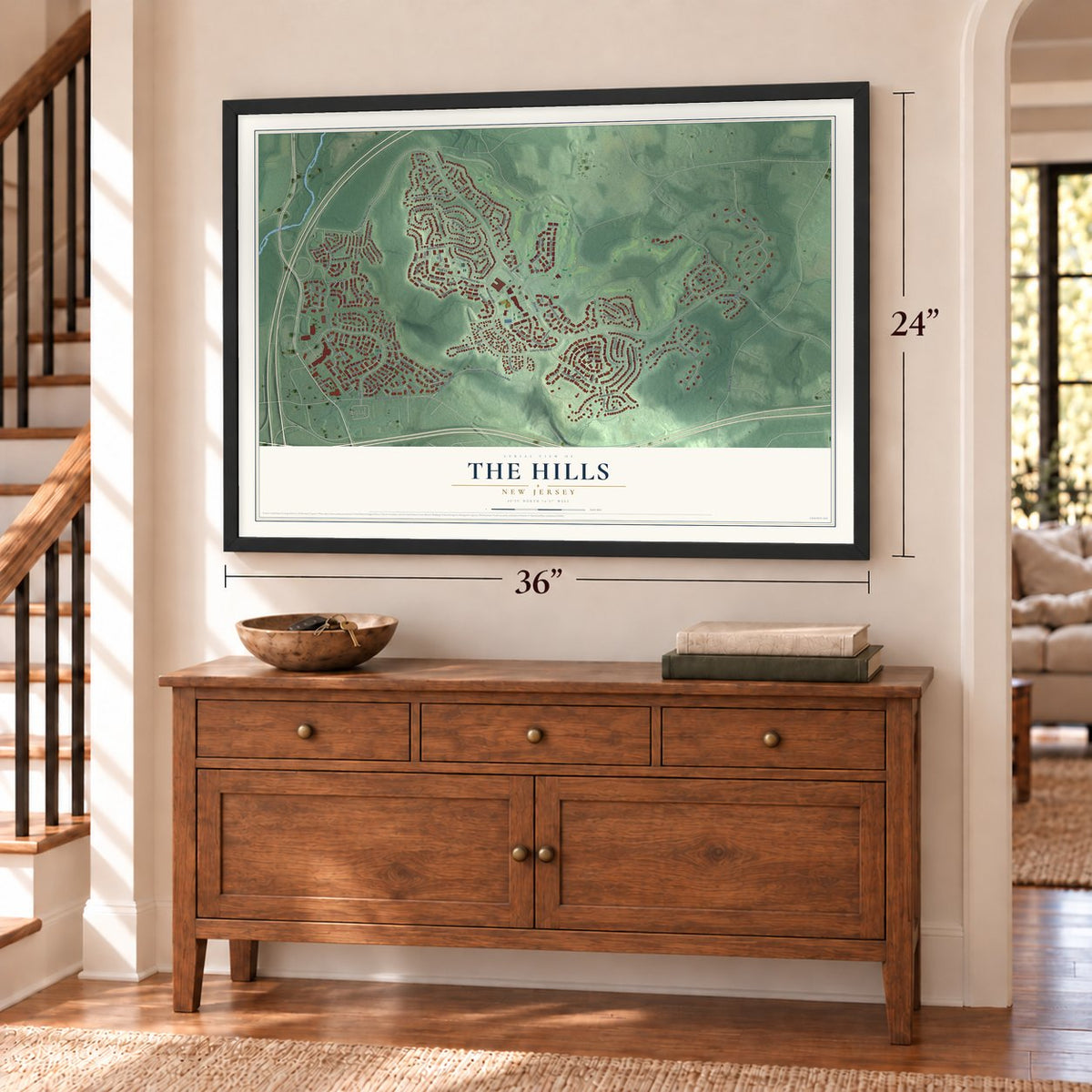 The Hills, New Jersey map, 24 x 36 inch print in a black frame above a dresser by a staircase
