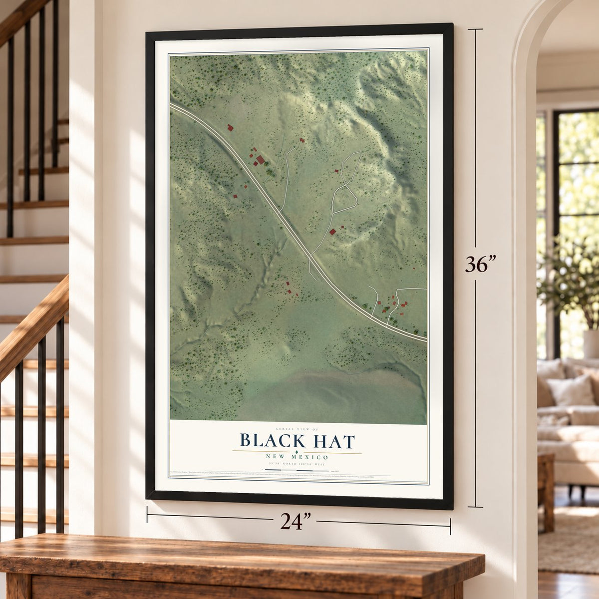 Black Hat, New Mexico map, 24 x 36 inch print in a black frame by a staircase