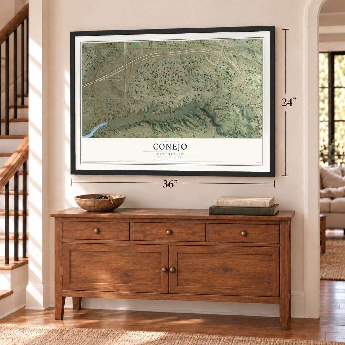 Conejo, New Mexico map, 24 x 36 inch print in a black frame above a dresser by a staircase