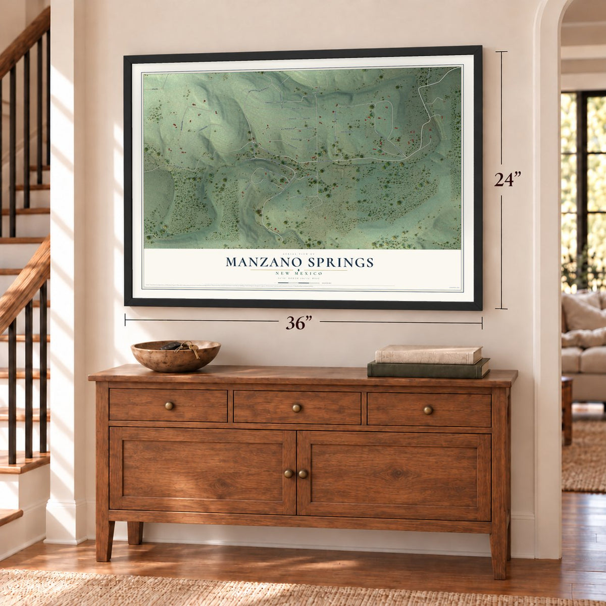Manzano Springs, New Mexico map, 24 x 36 inch print in a black frame above a dresser by a staircase