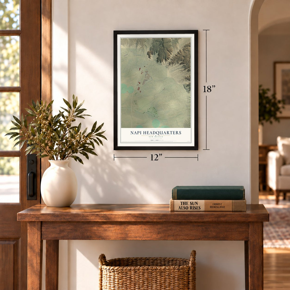 Napi Headquarters, New Mexico map, 12 x 18 inch print in a black frame in an entryway