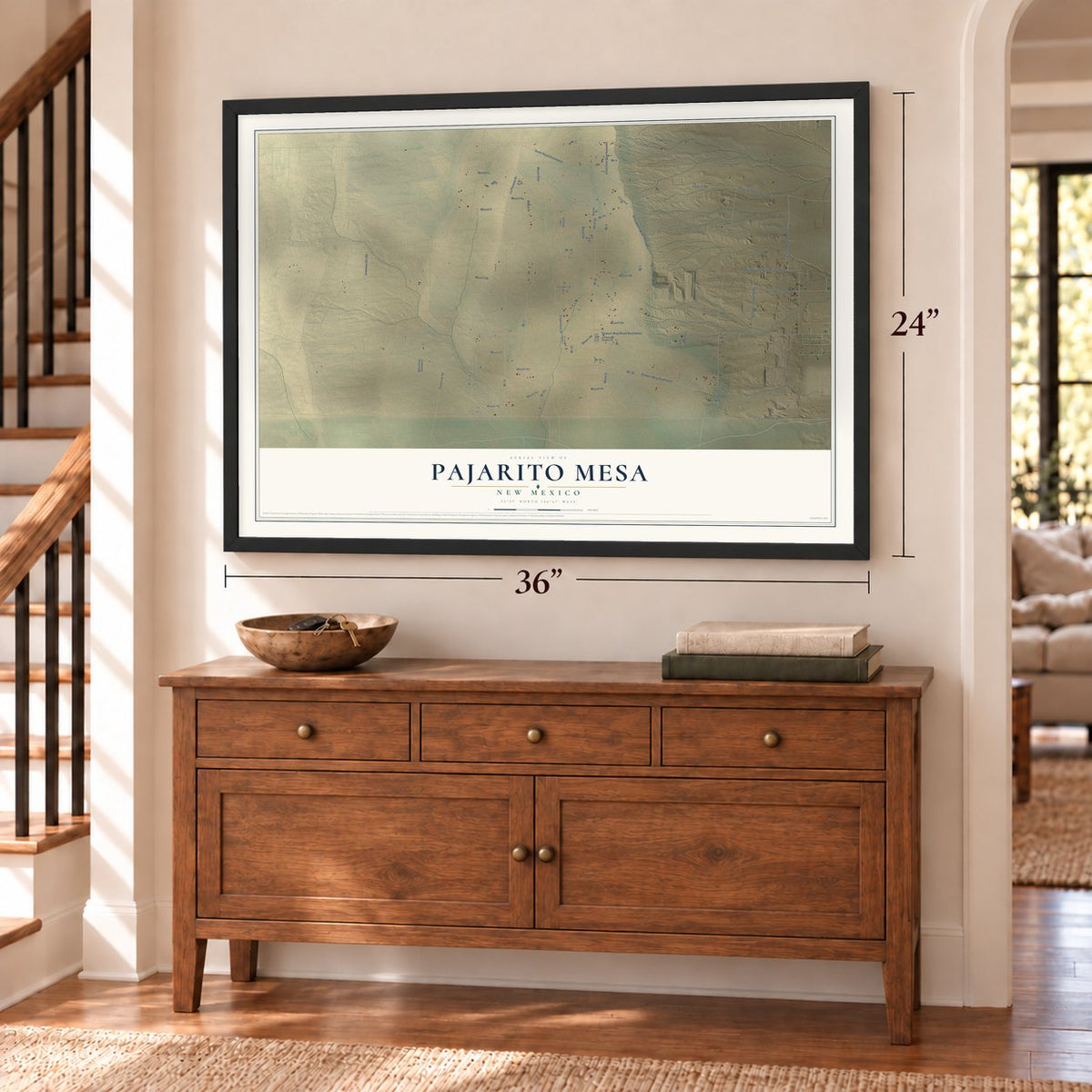 Pajarito Mesa, New Mexico map, 24 x 36 inch print in a black frame above a dresser by a staircase