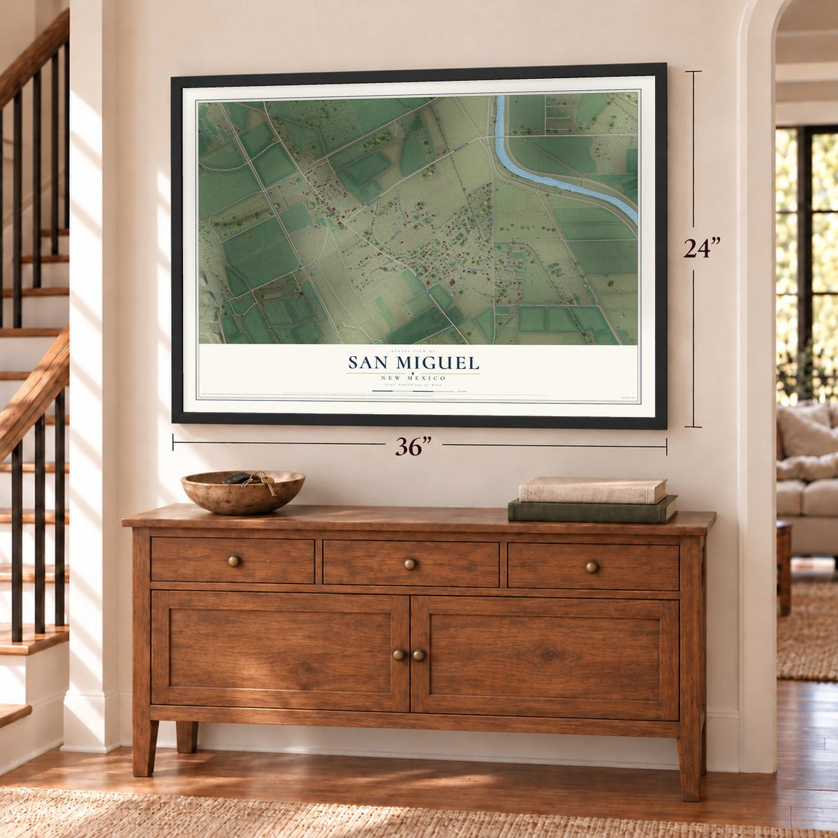San Miguel, New Mexico map, 24 x 36 inch print in a black frame above a dresser by a staircase