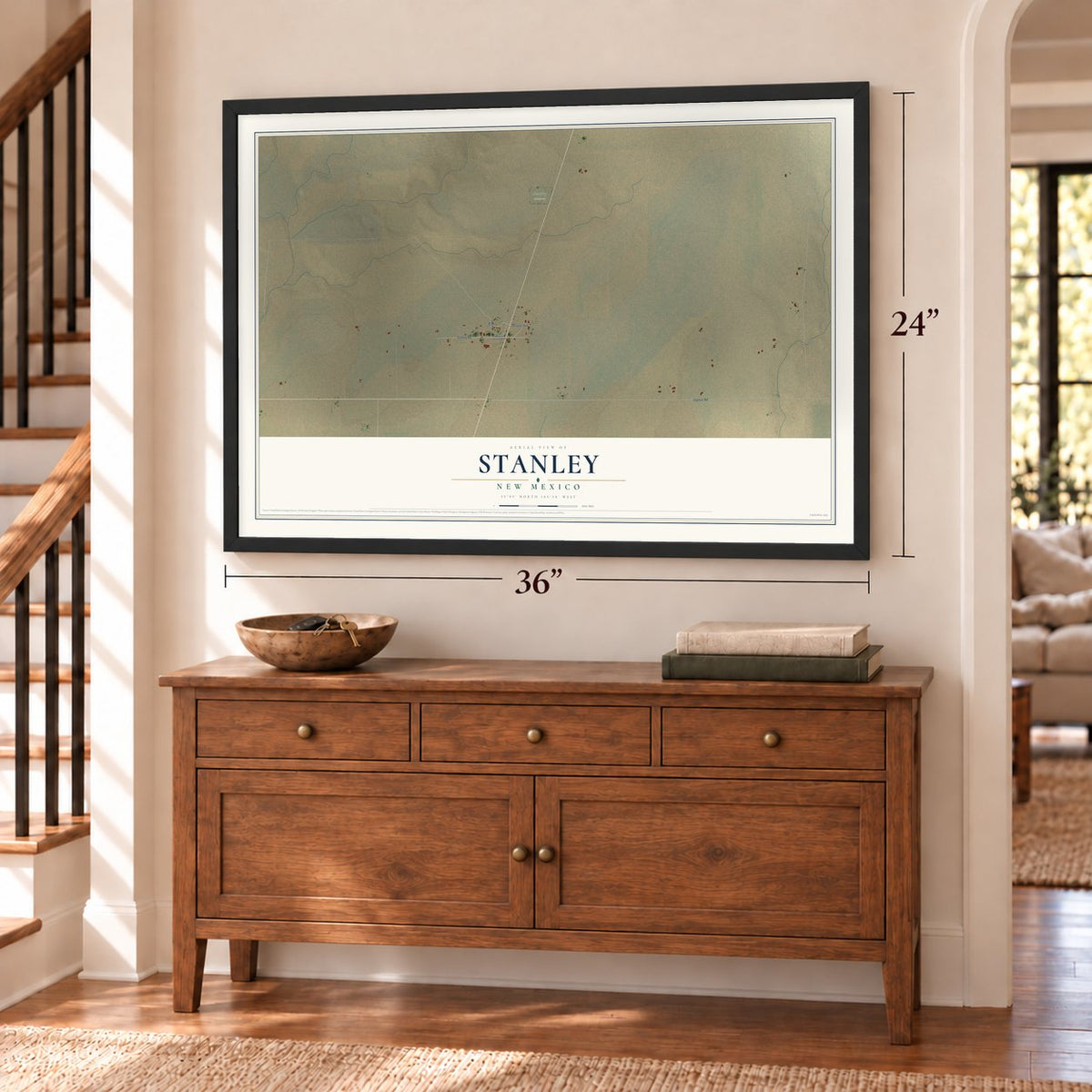 Stanley, New Mexico map, 24 x 36 inch print in a black frame above a dresser by a staircase