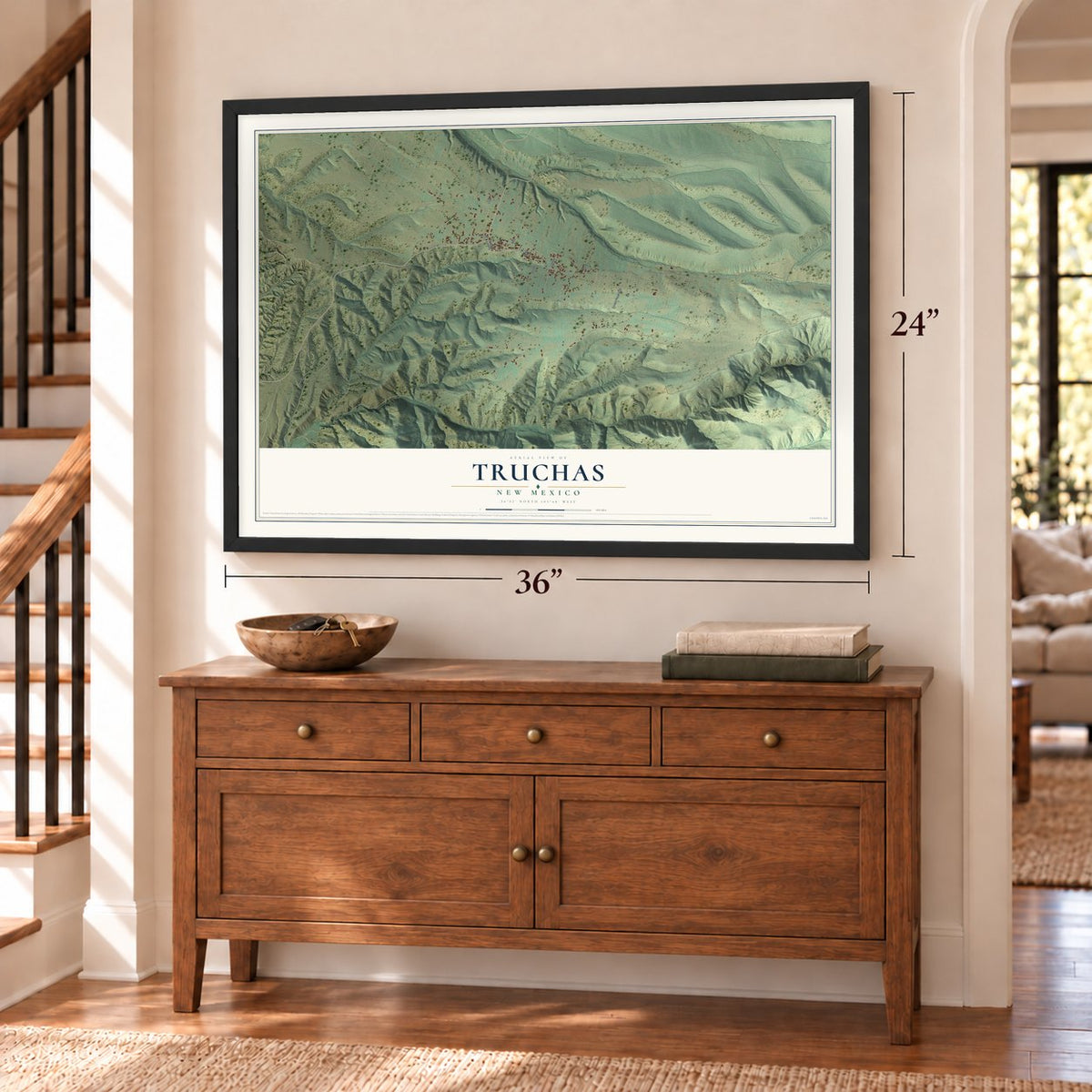 Truchas, New Mexico map, 24 x 36 inch print in a black frame above a dresser by a staircase