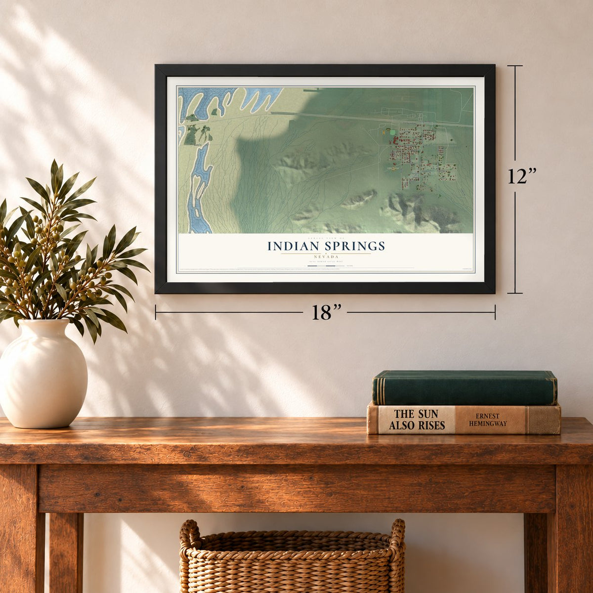 Indian Springs, Nevada map, 12 x 18 inch print in a black frame in an entryway