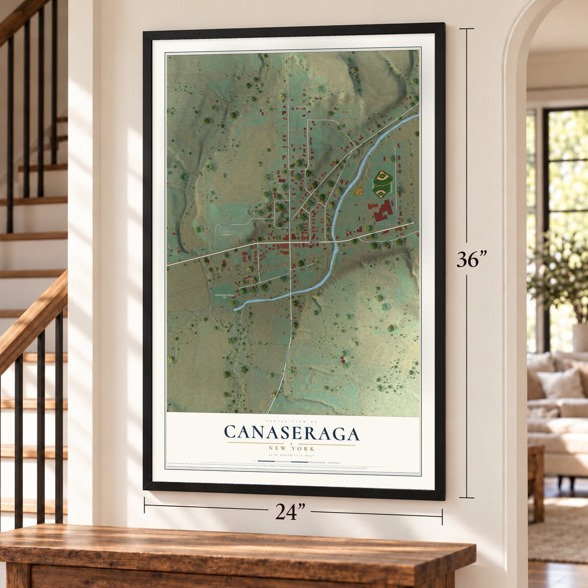 Canaseraga, New York map, 24 x 36 inch print in a black frame by a staircase