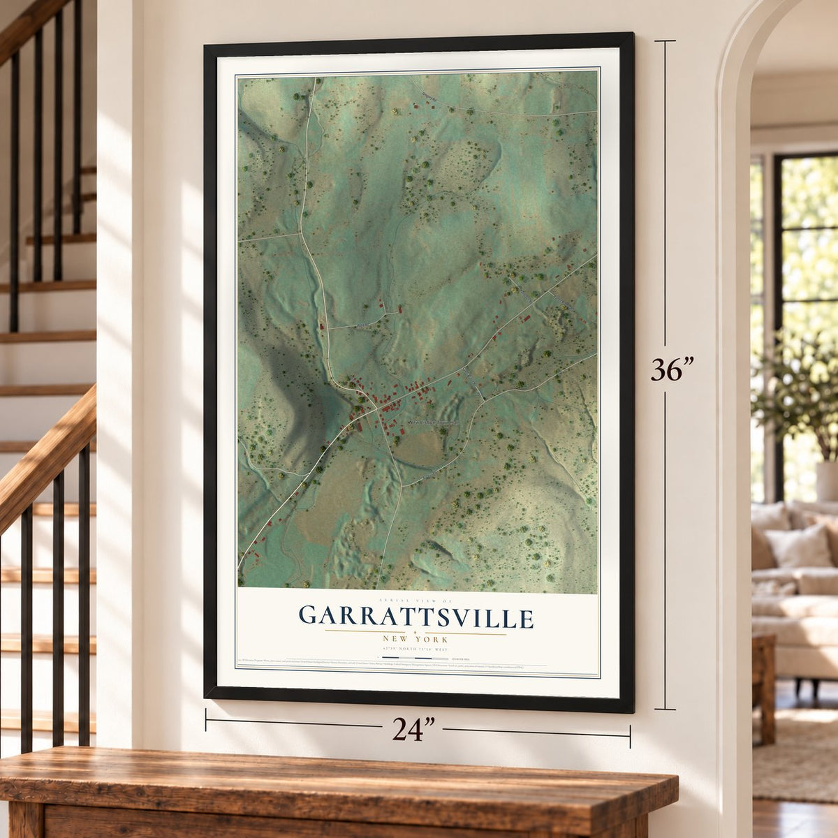Garrattsville, New York map, 24 x 36 inch print in a black frame by a staircase