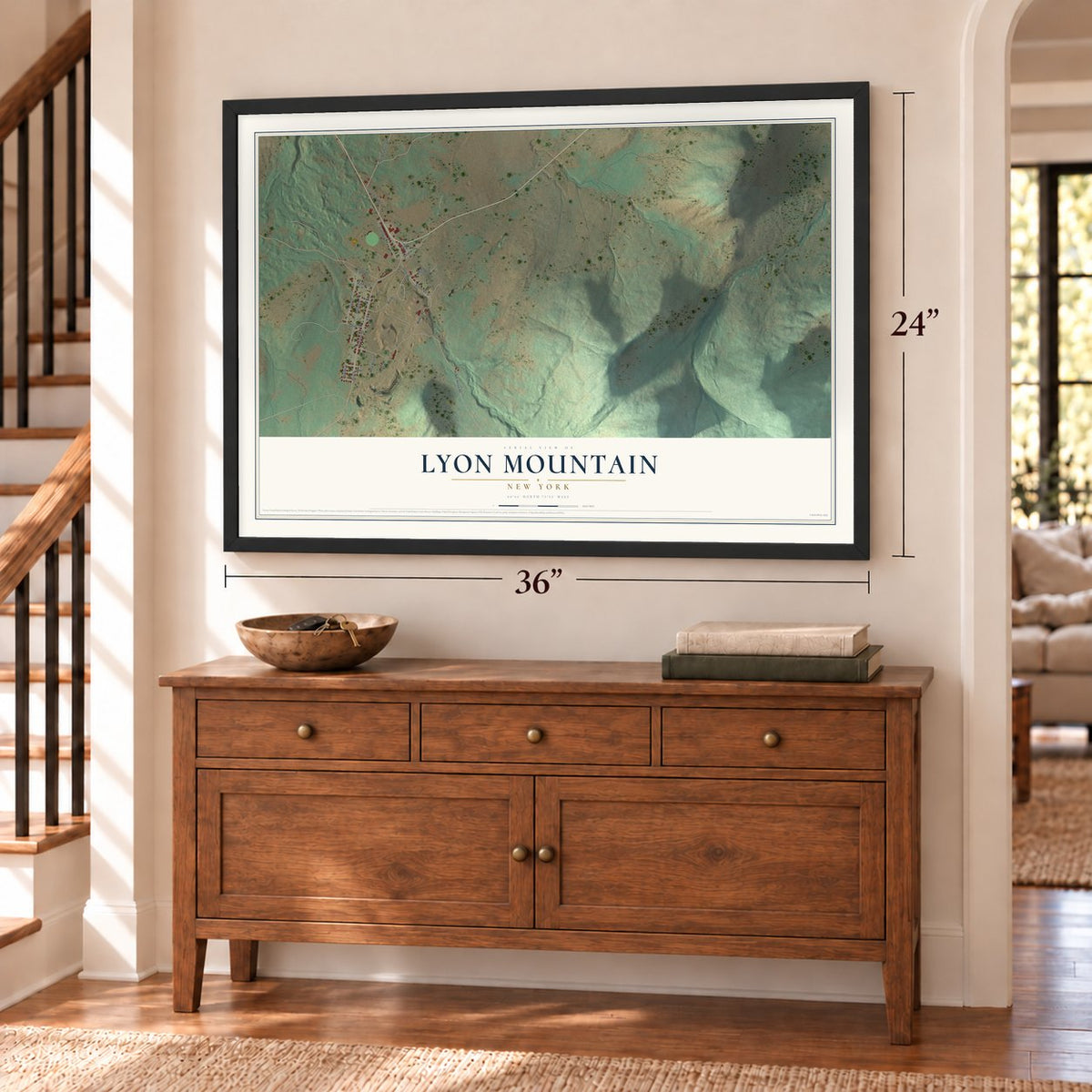 Lyon Mountain, New York map, 24 x 36 inch print in a black frame above a dresser by a staircase