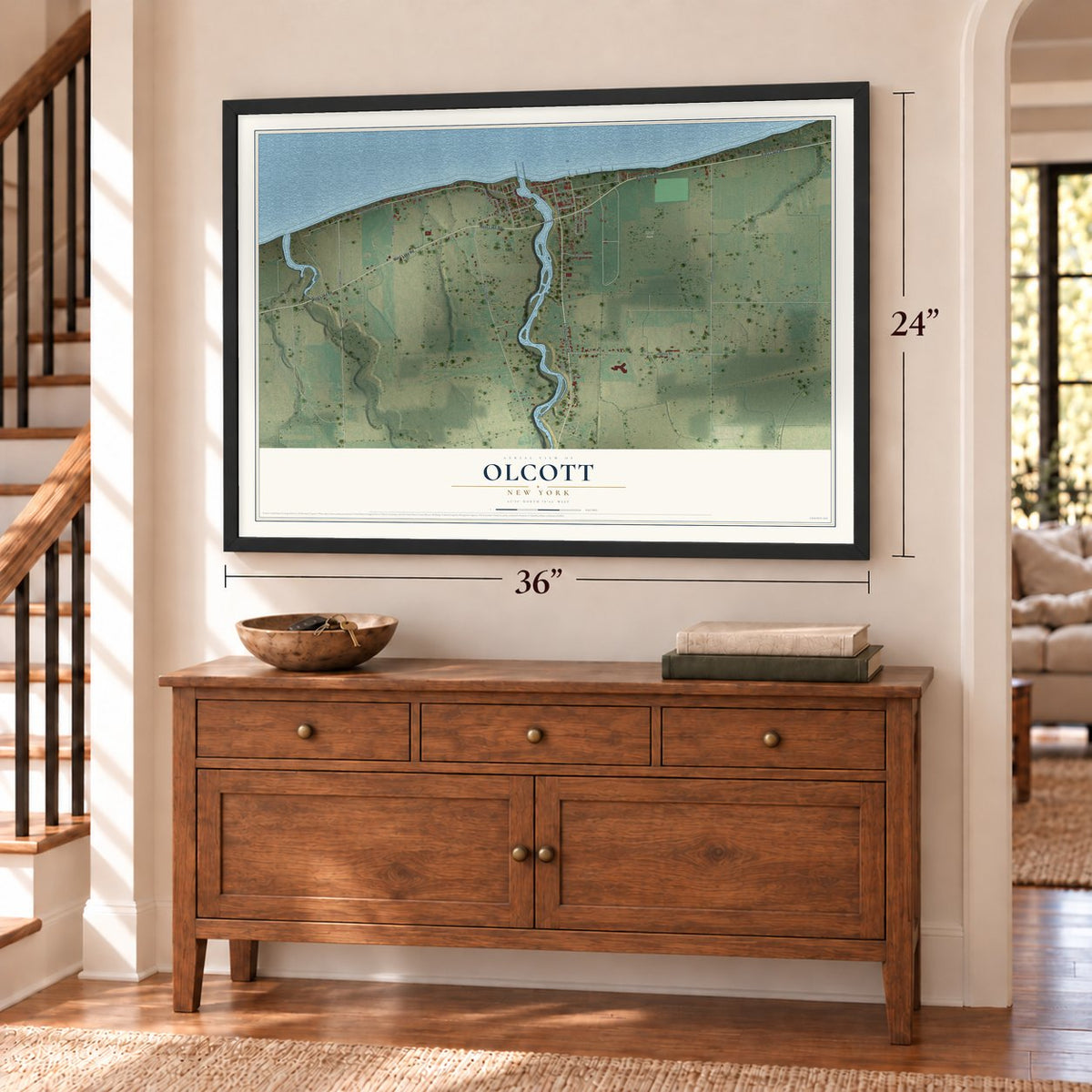 Olcott, New York map, 24 x 36 inch print in a black frame above a dresser by a staircase