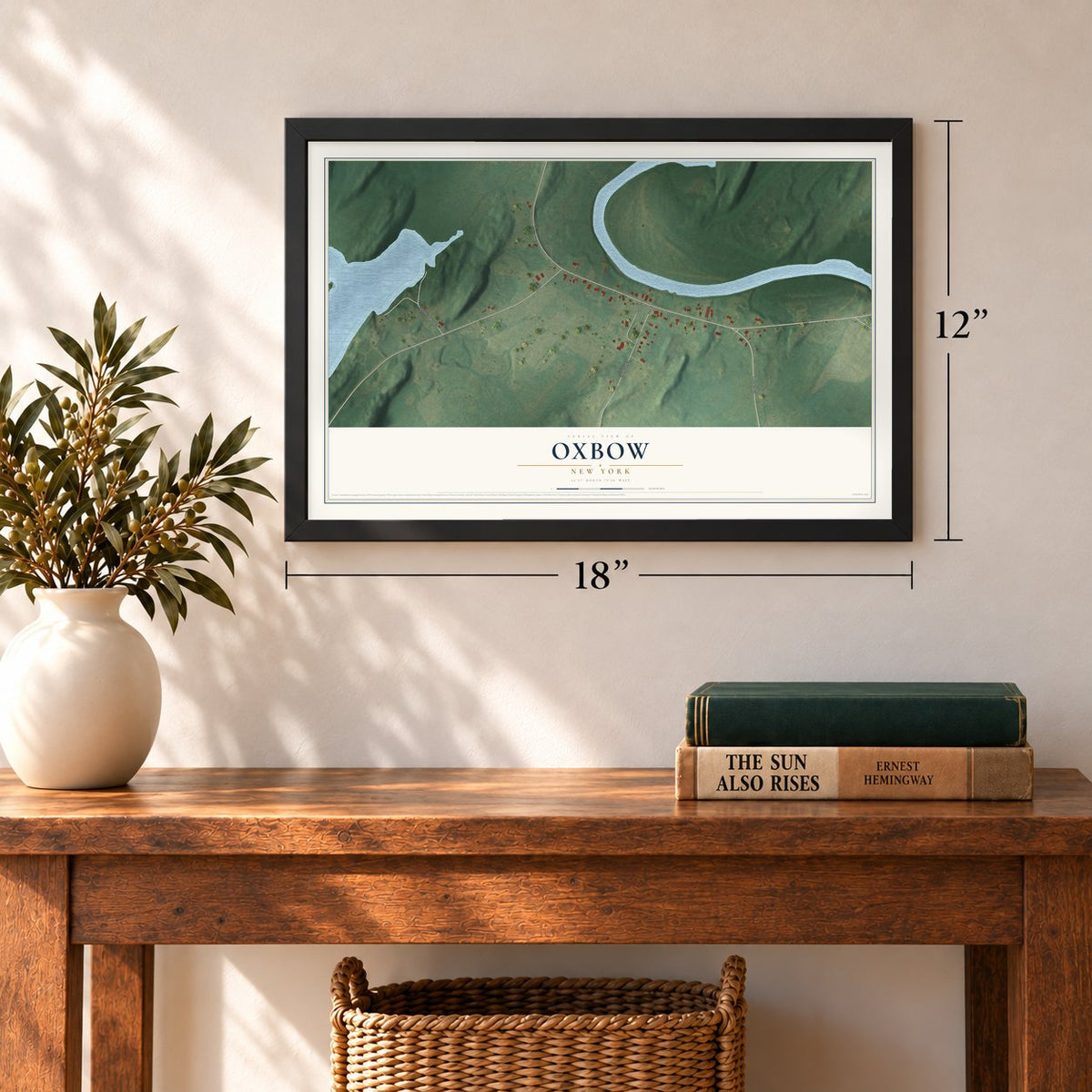 Oxbow, New York map, 12 x 18 inch print in a black frame in an entryway