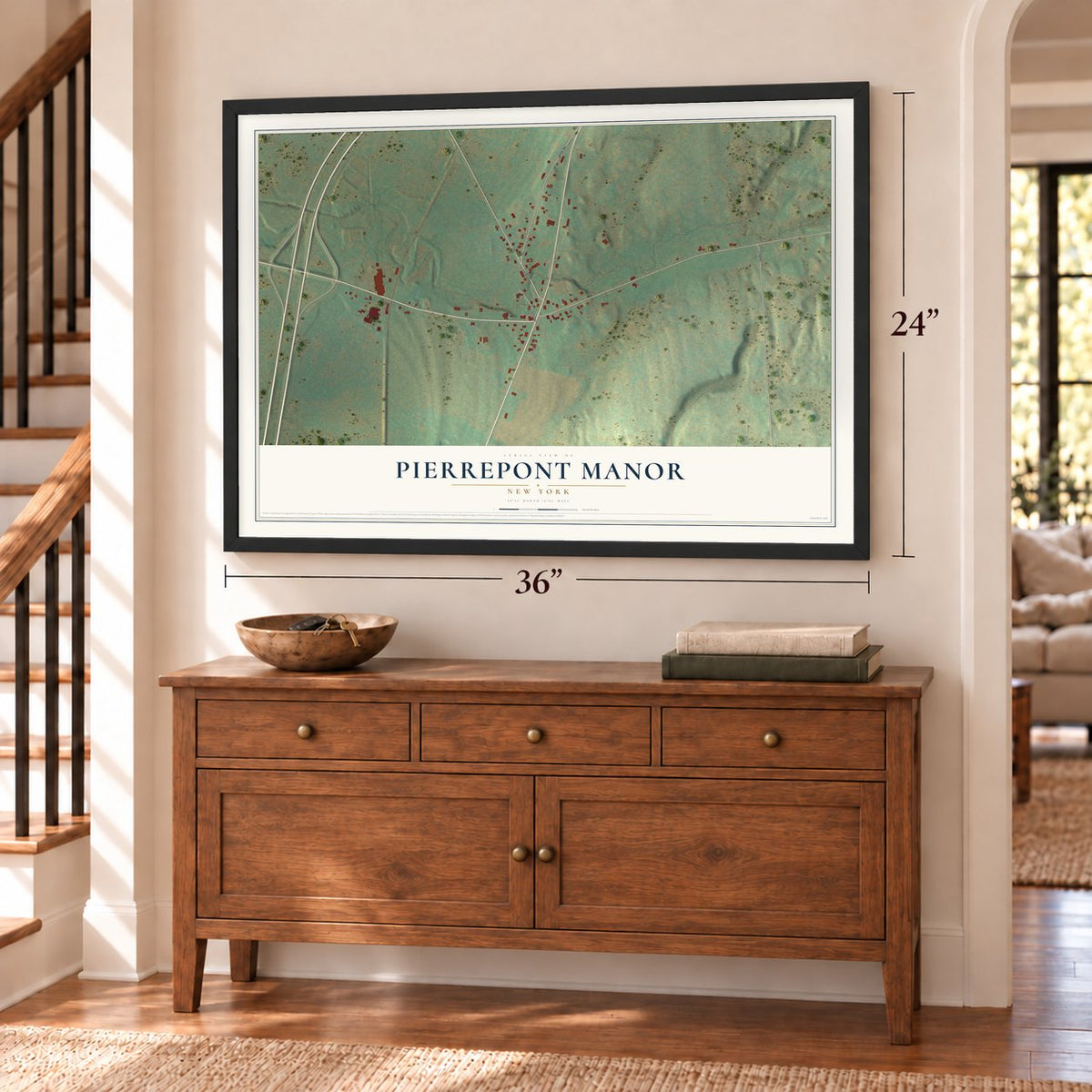 Pierrepont Manor, New York map, 24 x 36 inch print in a black frame above a dresser by a staircase