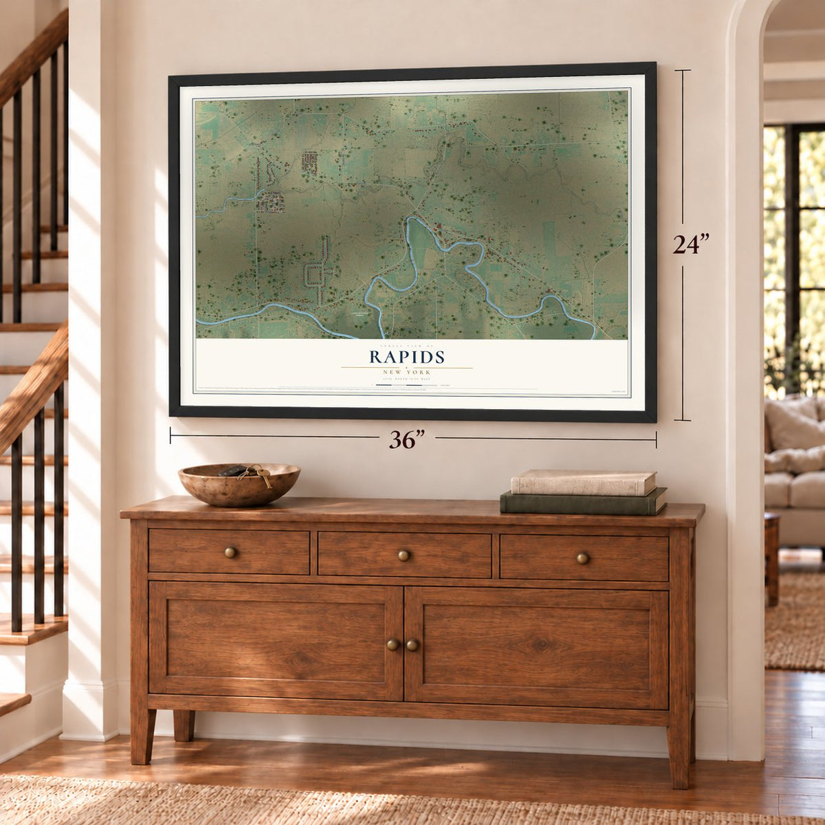 Rapids, New York map, 24 x 36 inch print in a black frame above a dresser by a staircase