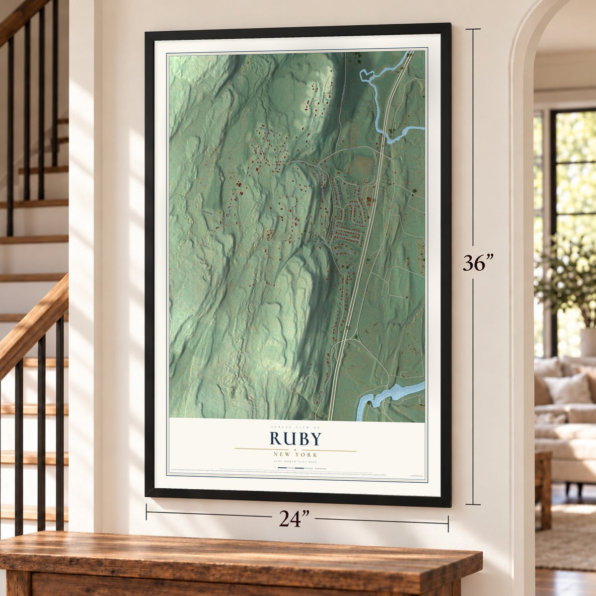 Ruby, New York map, 24 x 36 inch print in a black frame by a staircase
