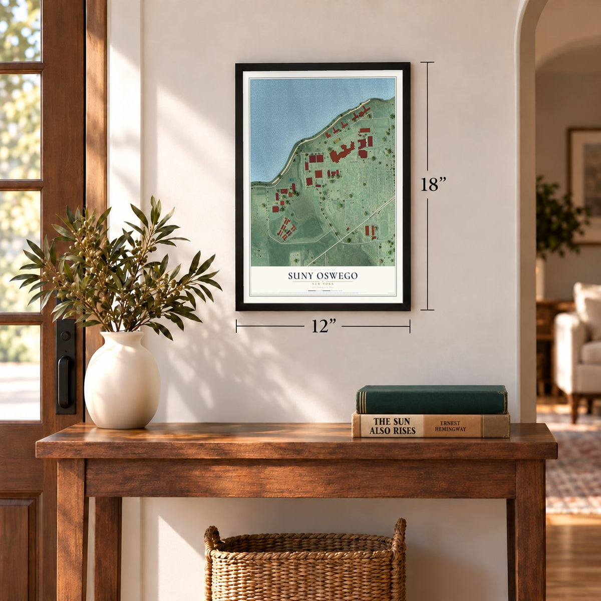SUNY Oswego, New York map, 12 x 18 inch print in a black frame in an entryway