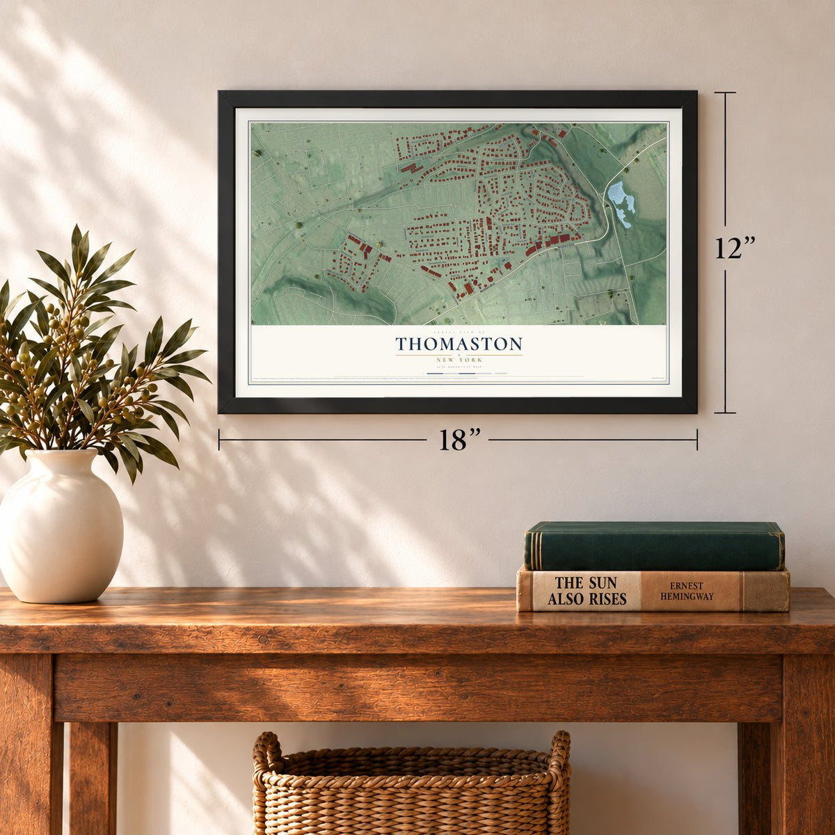 Thomaston, New York map, 12 x 18 inch print in a black frame in an entryway