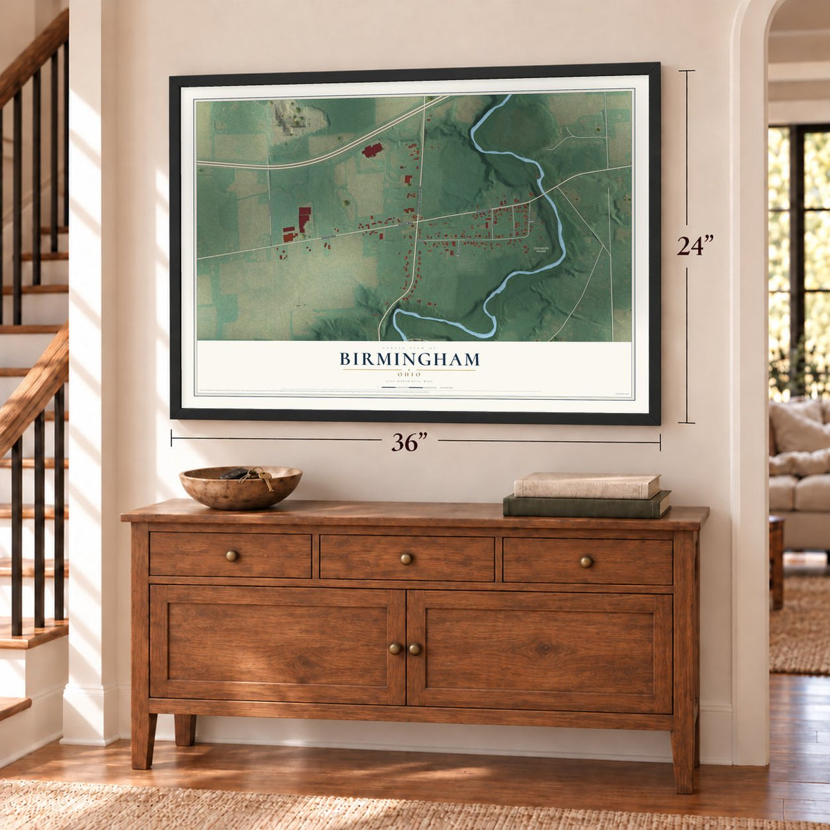 Birmingham, Ohio map, 24 x 36 inch print in a black frame above a dresser by a staircase