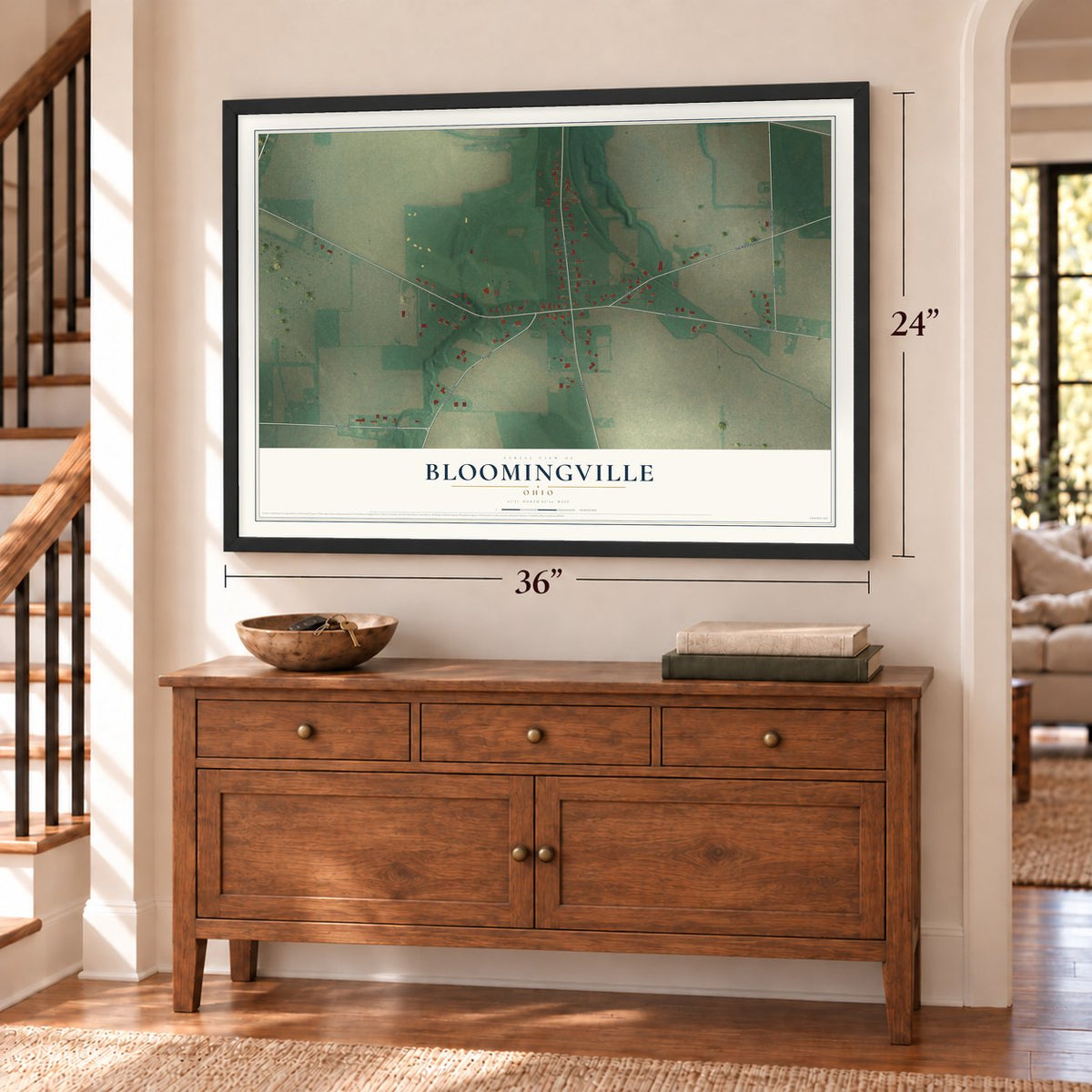 Bloomingville, Ohio map, 24 x 36 inch print in a black frame above a dresser by a staircase