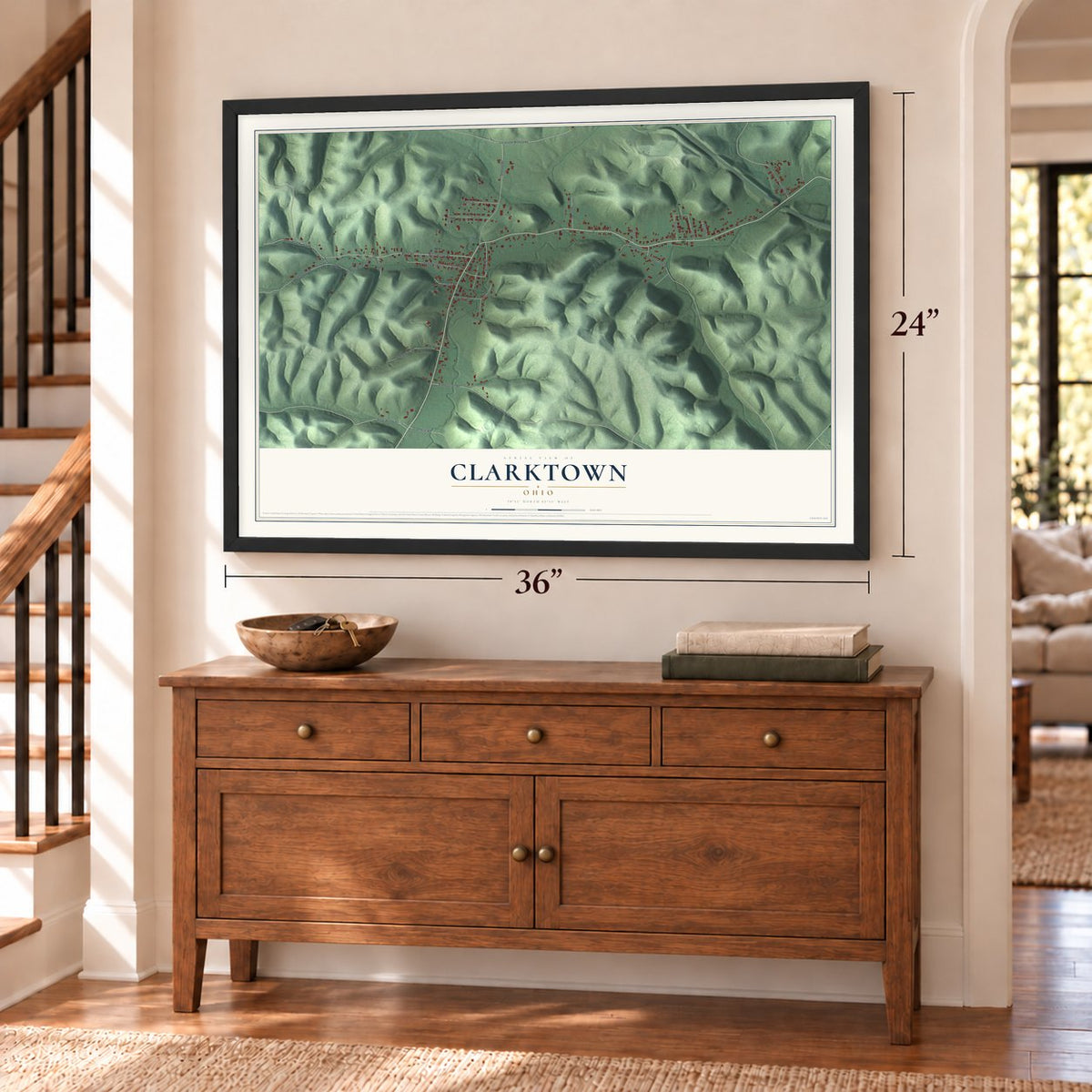 Clarktown, Ohio map, 24 x 36 inch print in a black frame above a dresser by a staircase