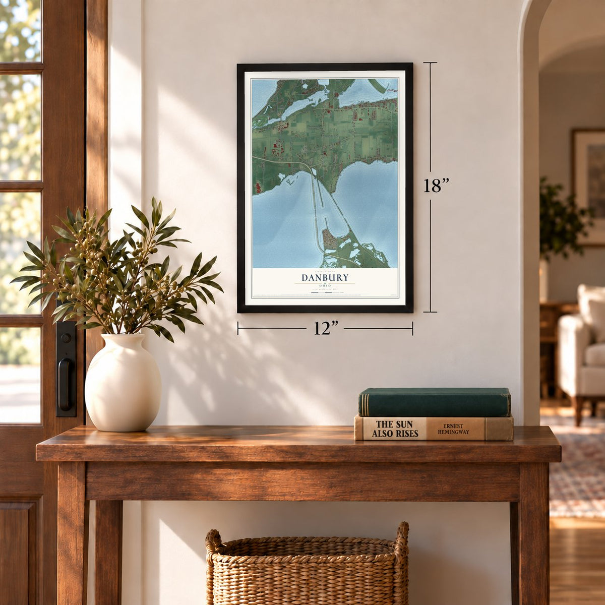 Danbury, Ohio map, 12 x 18 inch print in a black frame in an entryway