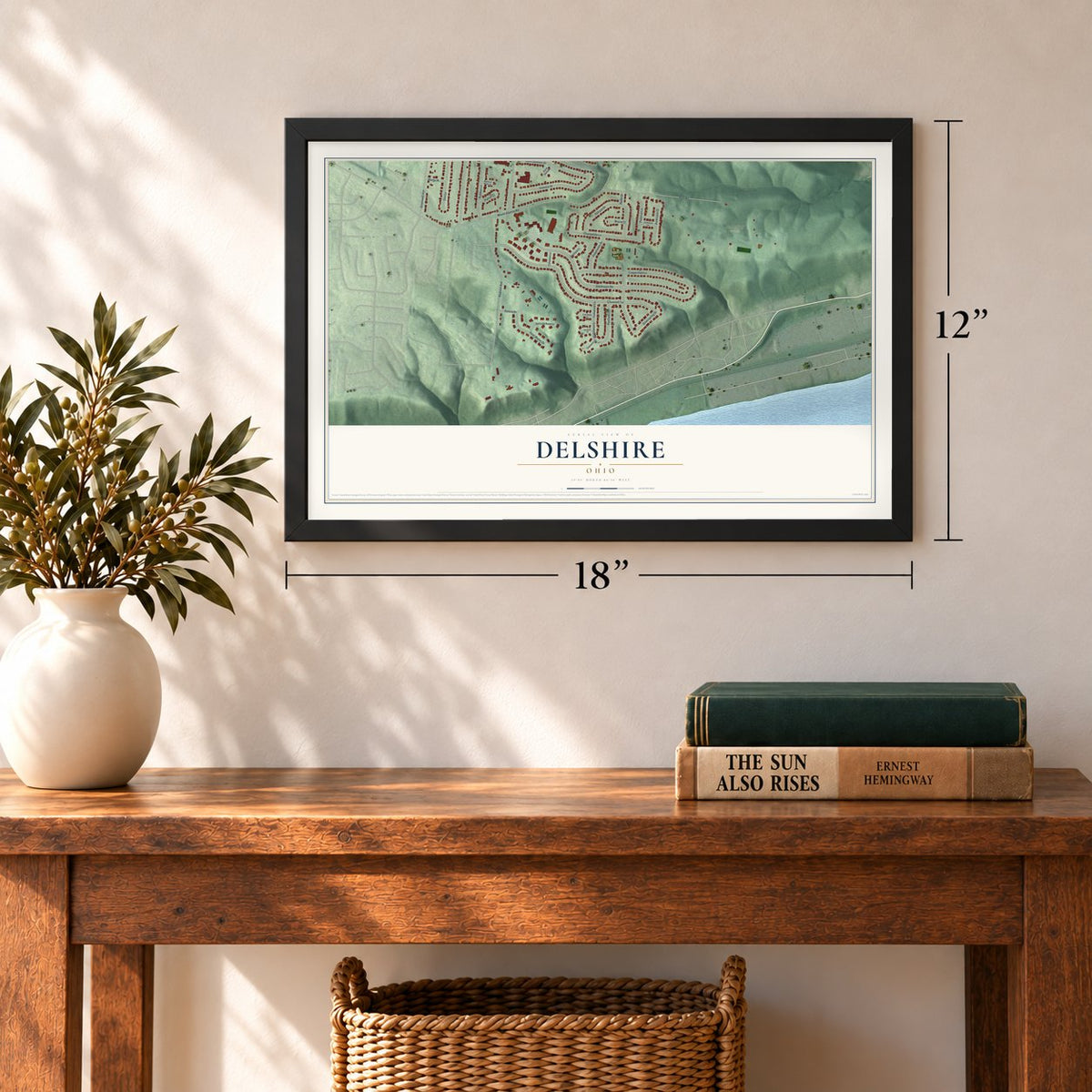 Delshire, Ohio map, 12 x 18 inch print in a black frame in an entryway