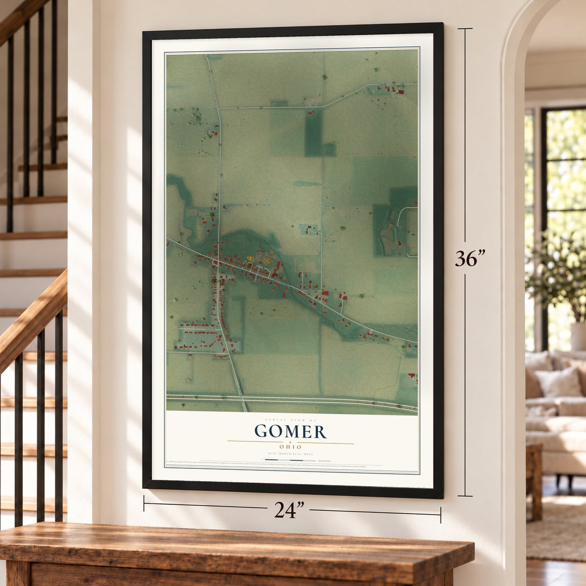 Gomer, Ohio map, 24 x 36 inch print in a black frame by a staircase