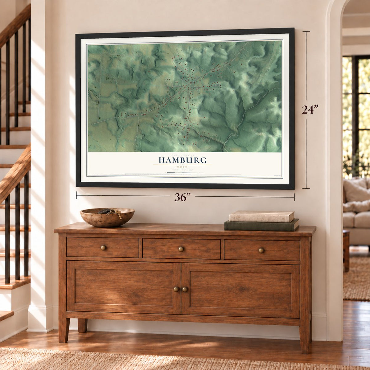 Hamburg, Ohio map, 24 x 36 inch print in a black frame above a dresser by a staircase