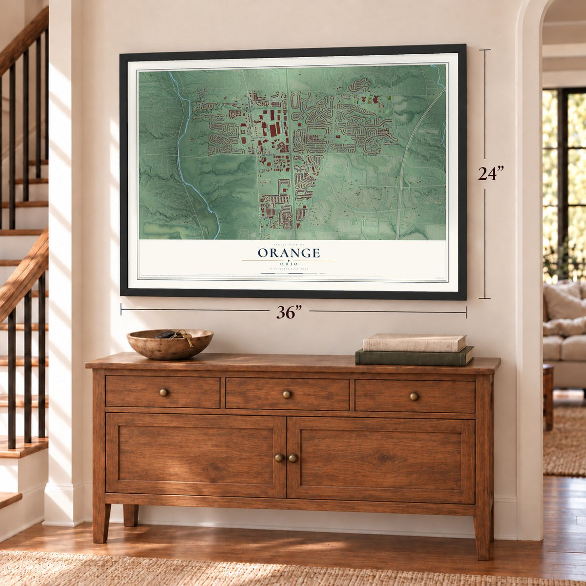 Orange, Delaware County, Ohio map, 24 x 36 inch print in a black frame above a dresser by a staircase
