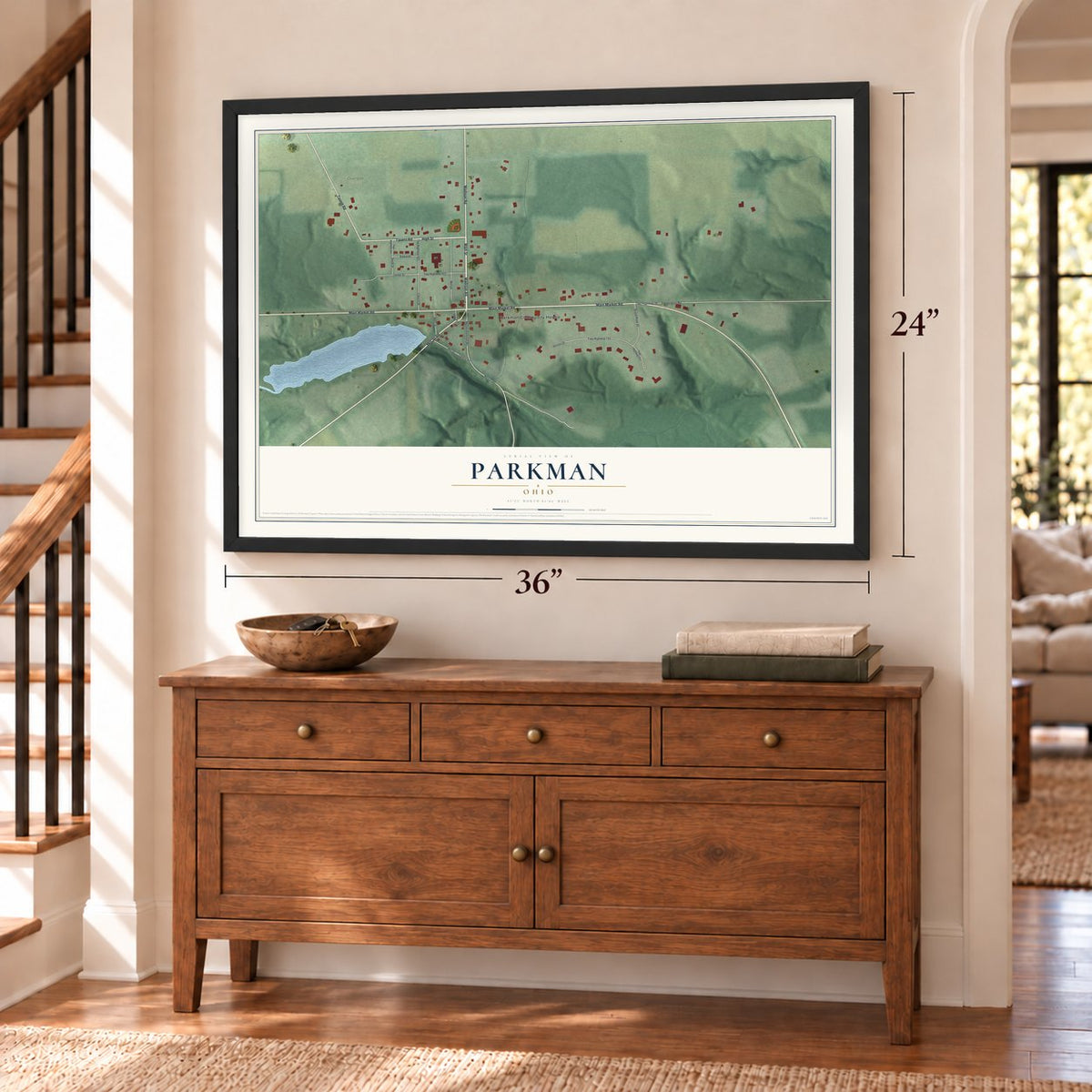 Parkman, Ohio map, 24 x 36 inch print in a black frame above a dresser by a staircase
